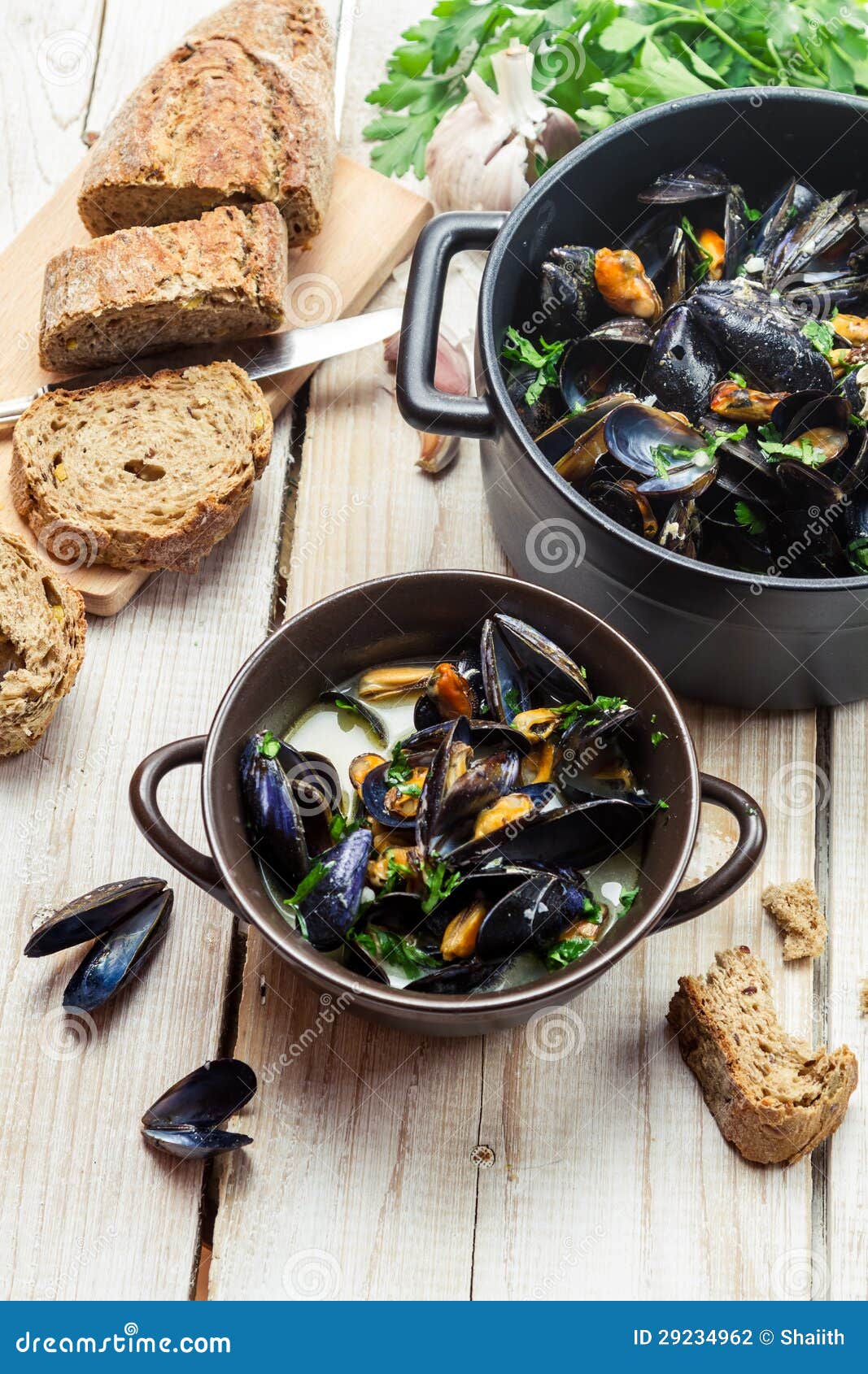 Freshly Cooked Mussels with Garlic and Parsley at Home Stock Photo
