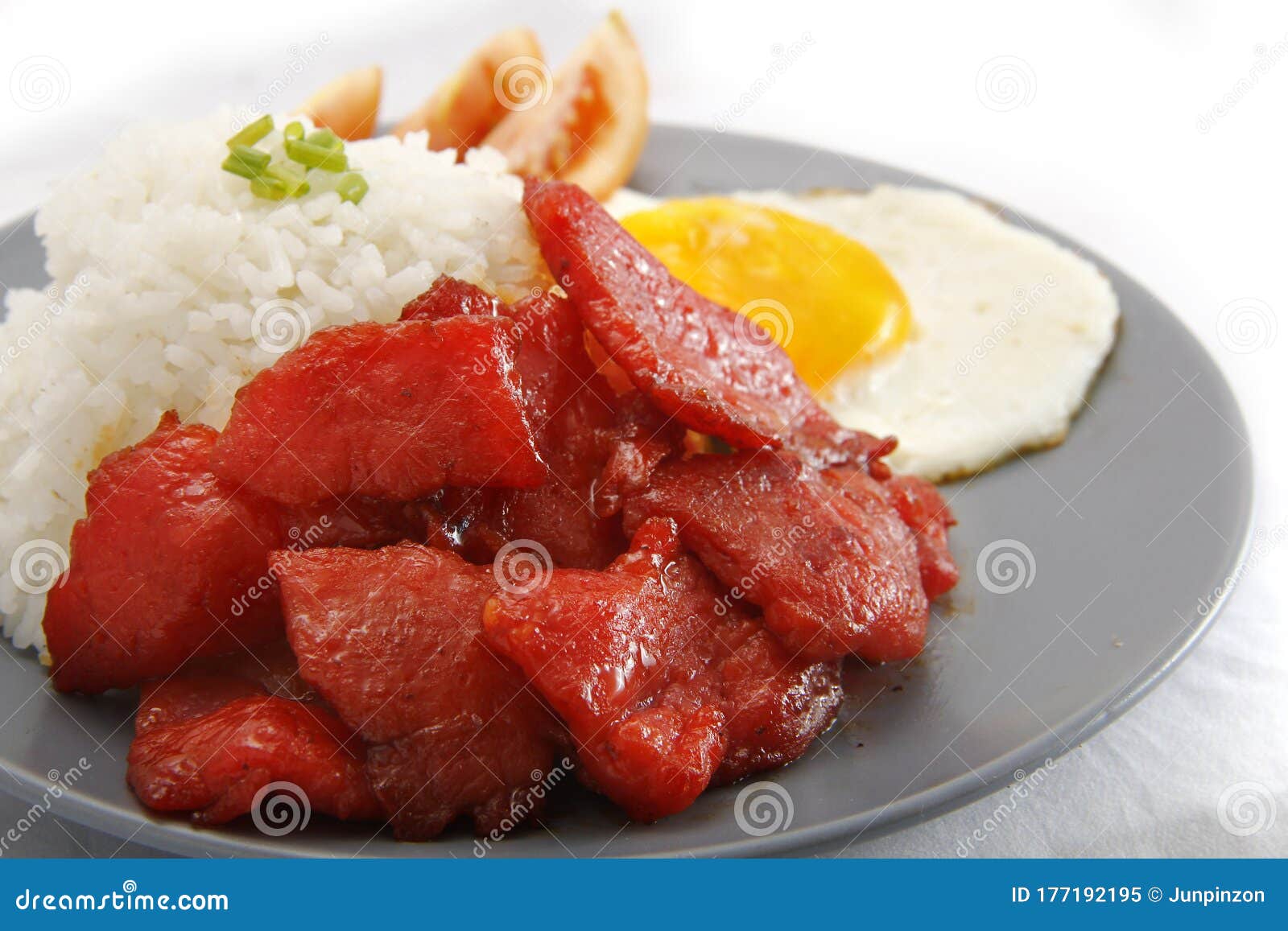 Freshly Cooked Tocino or Cured Pork Meat Served with Fried Rice and Egg