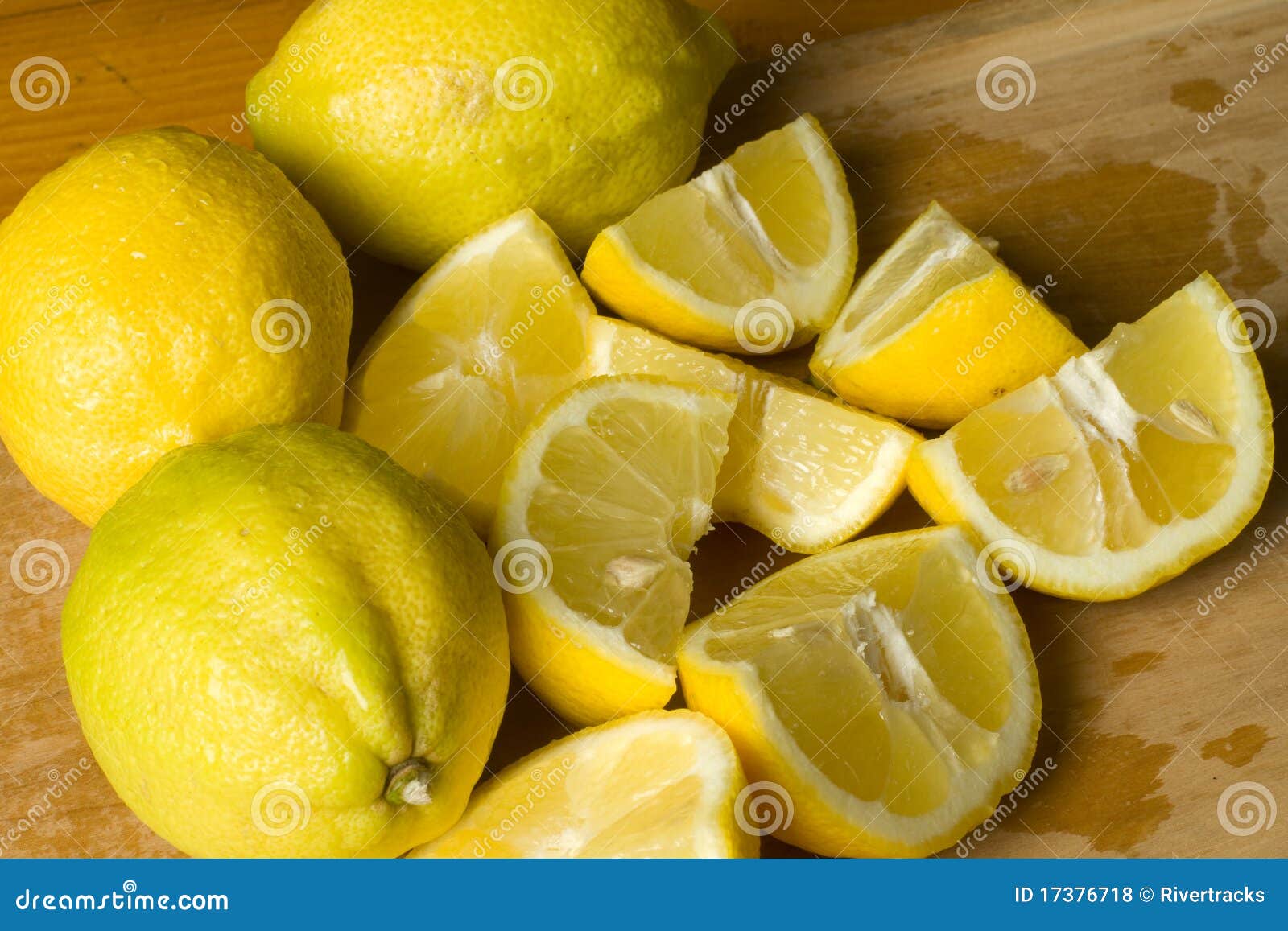 Freshly cut lemon wedges stock photo. Image of market 17376718