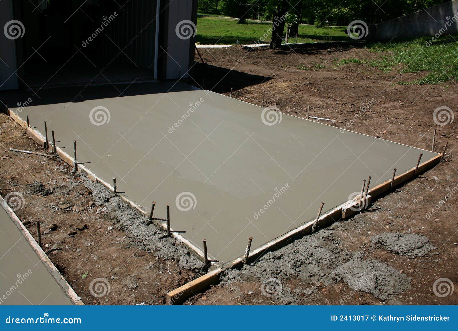 freshly poured concrete pad