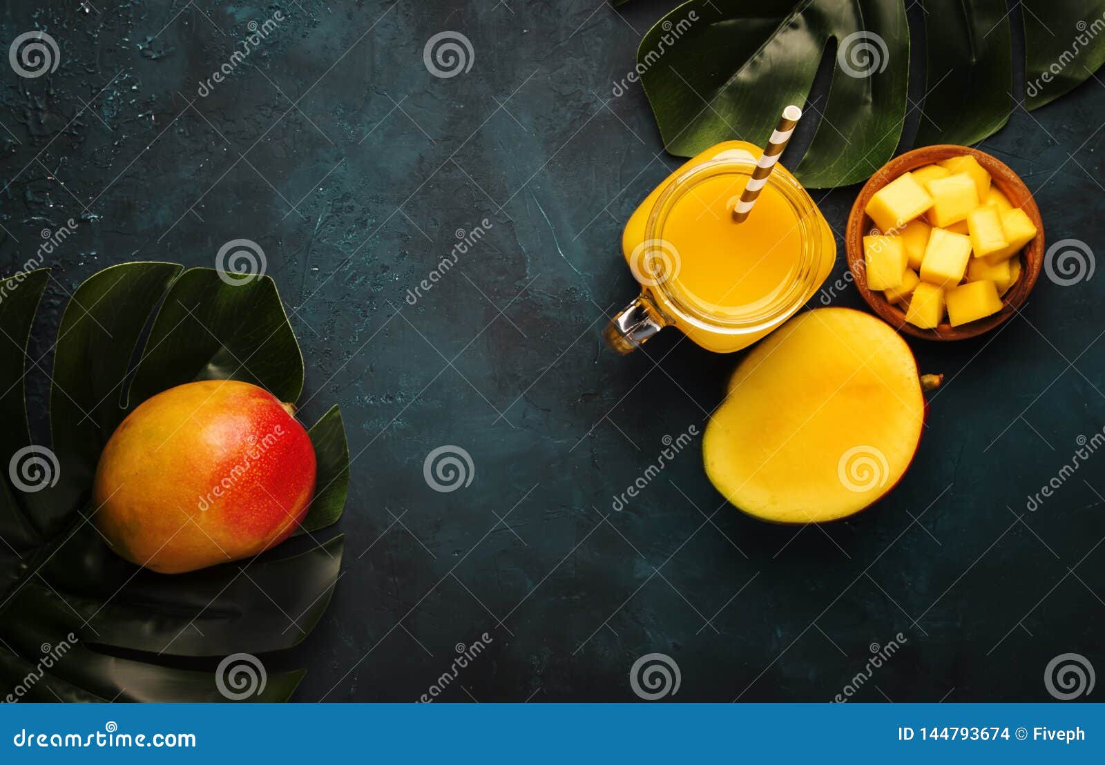 https://thumbs.dreamstime.com/z/freshly-squeezed-fresh-mango-juice-large-glass-jar-fresh-fruit-dark-blue-background-place-text-top-view-freshly-144793674.jpg