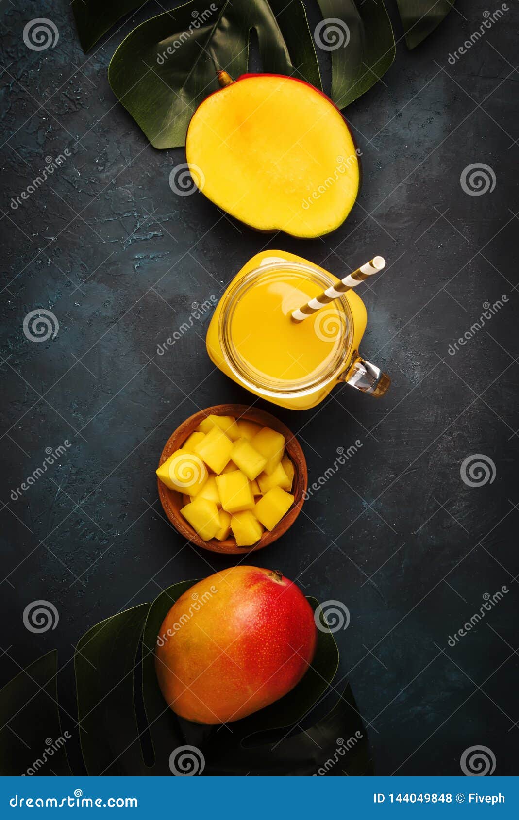 https://thumbs.dreamstime.com/z/freshly-squeezed-fresh-mango-juice-large-glass-jar-fruit-dark-blue-background-place-text-top-view-144049848.jpg