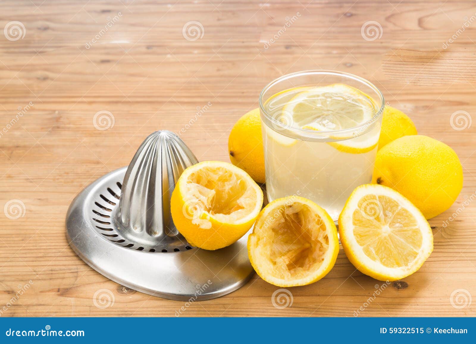 Freshly Squeezed Organic Lemon Juice with Glass and Squeezer. Stock