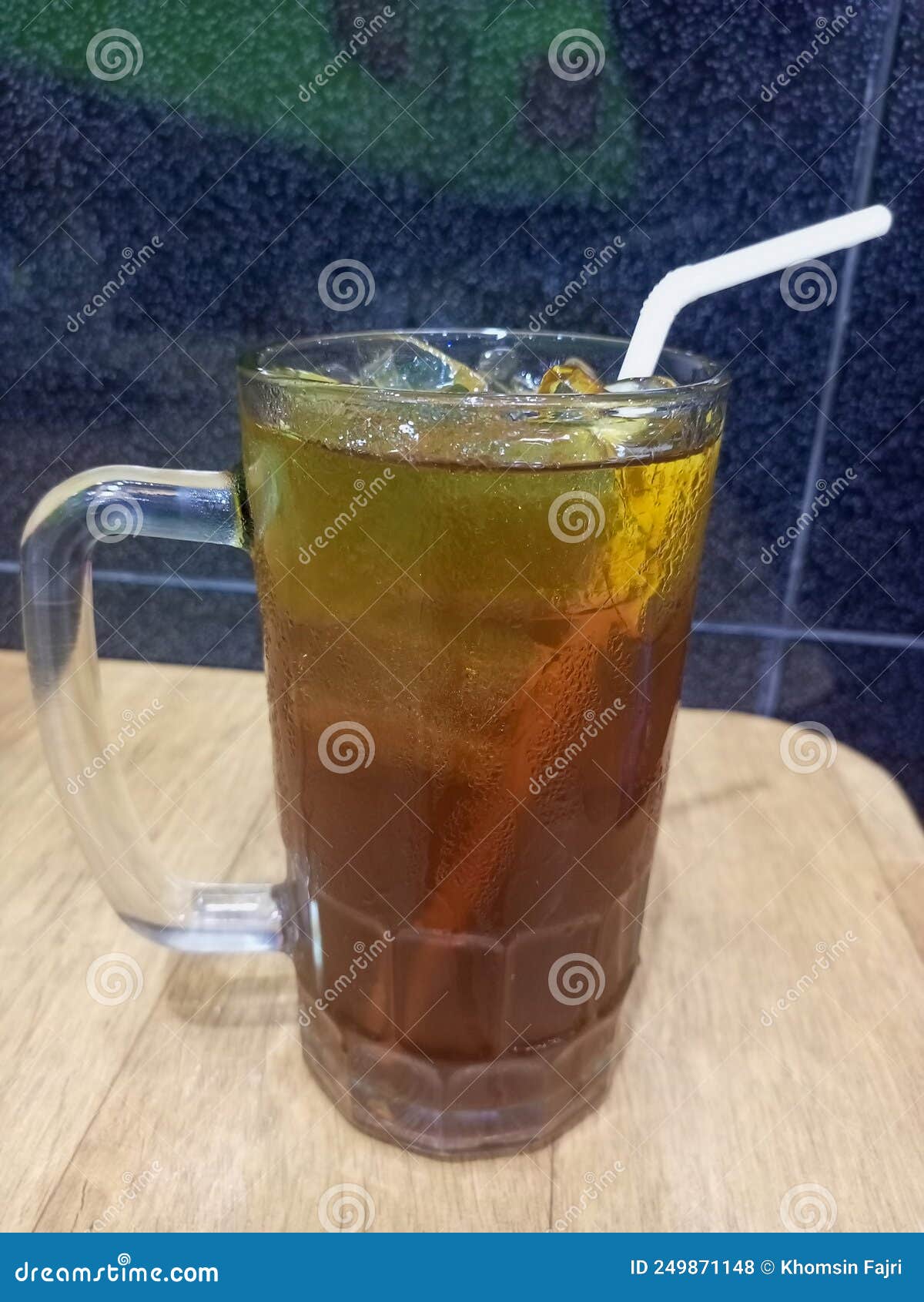 The Freshness of a Glass of Sweet Iced Tea while Enjoying Dinner Stock