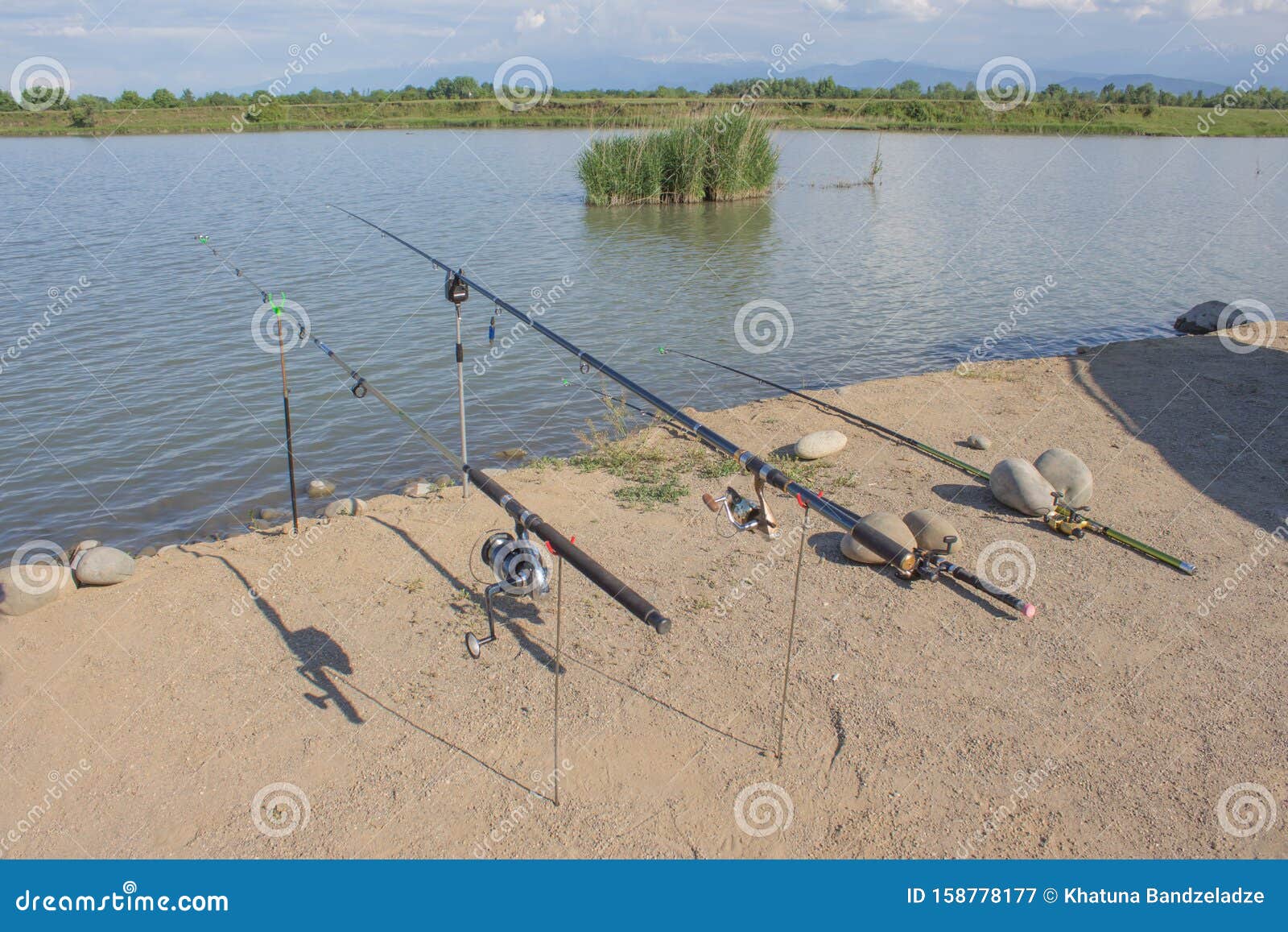 Freshwater Angling with Rods beside a Lake. Fishing Rod on a Prop and Water  Background Stock Image - Image of fisher, catch: 158778177