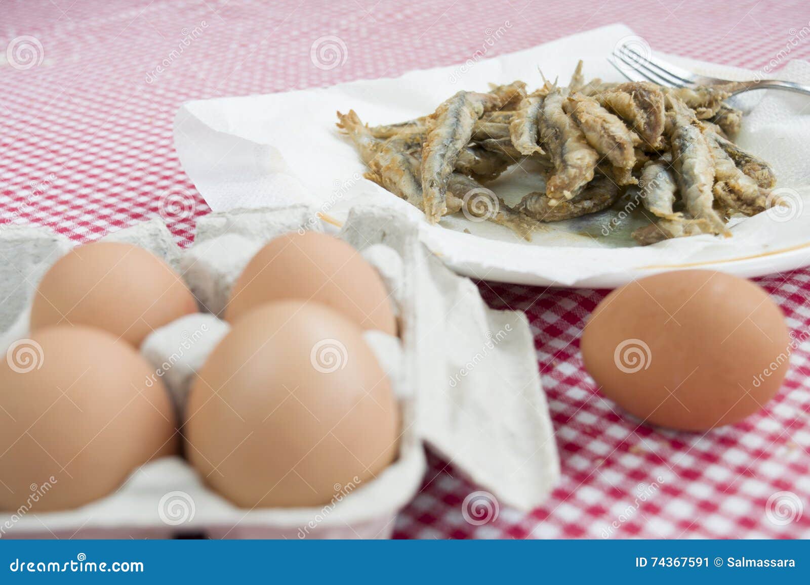 Fried Anchovies with in Foreground Fresh Eggs Stock Image Image of