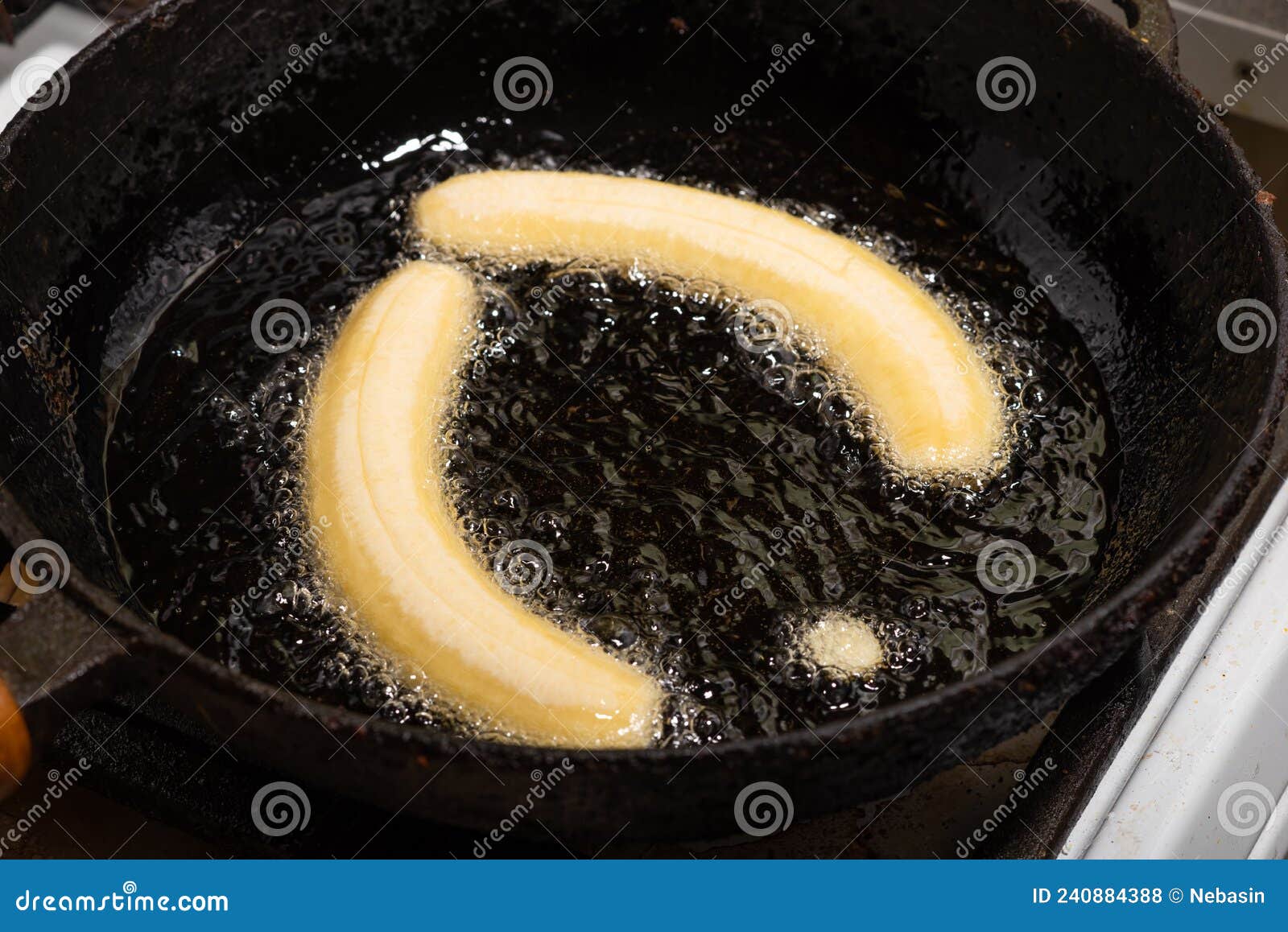 Fried Bananas in a Pan. Raw Bananas Boiled in Oil Stock Photo Image of iron, banana 240884388