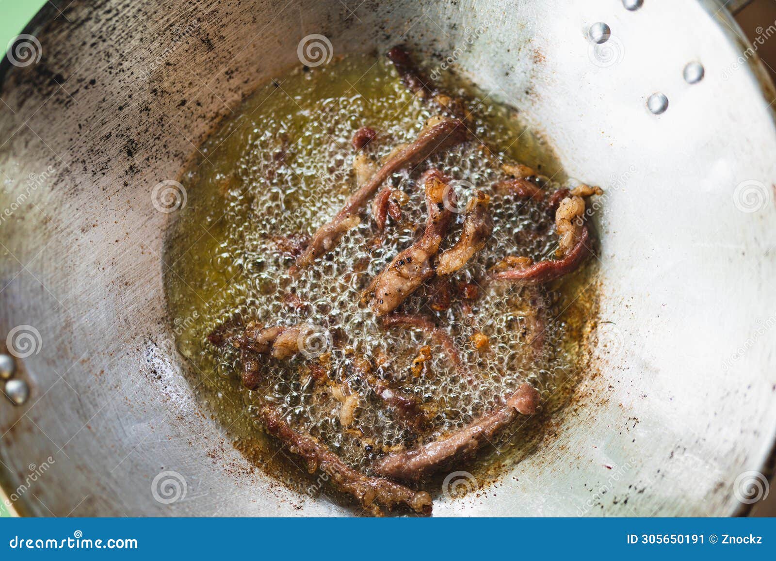 Fried Beef or Deep Fried Beef Thai Style on Hot Oil Pan Stock Image