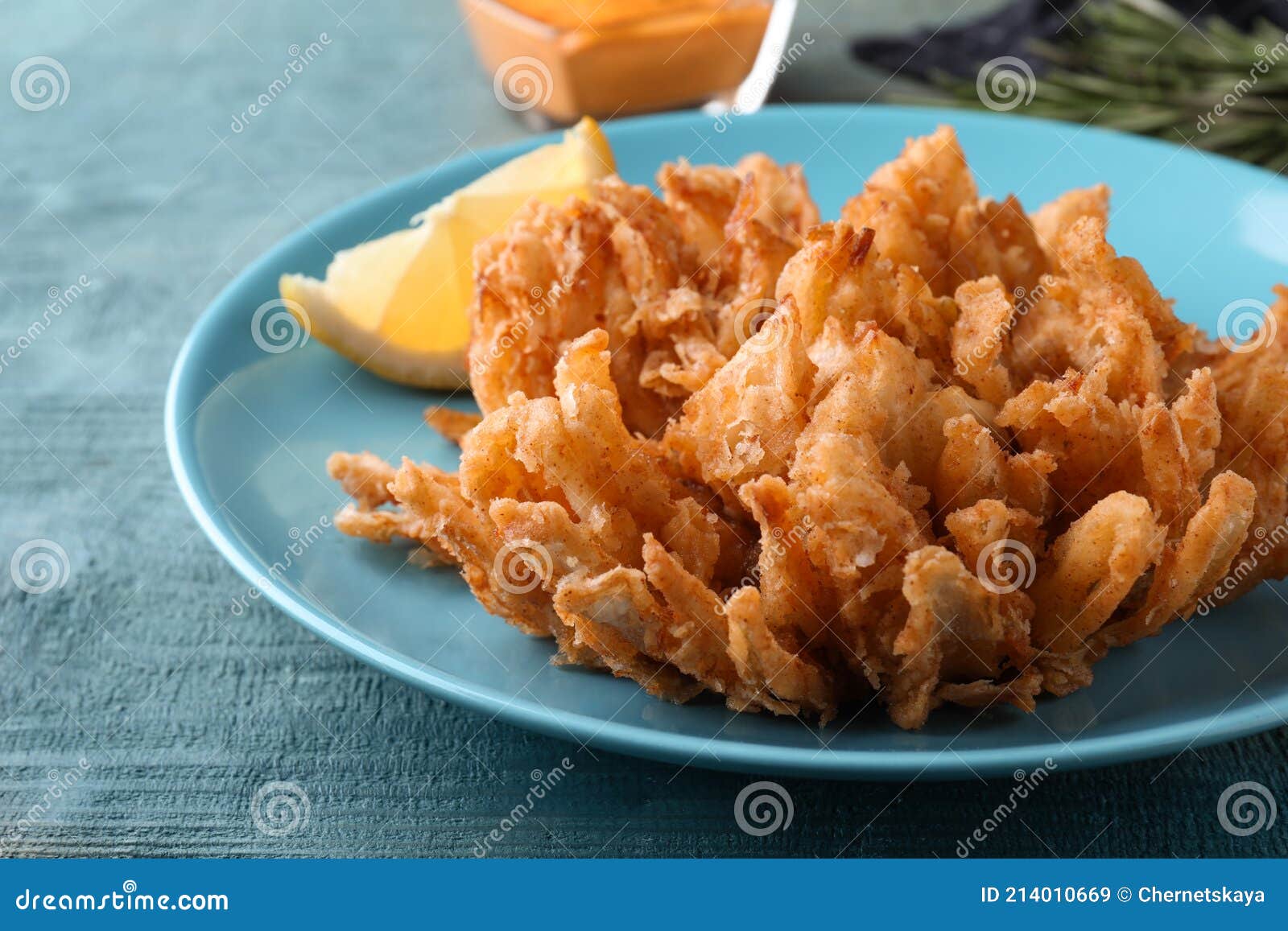 Fried Blooming Onion Served on Blue Wooden Table, Closeup Stock Image