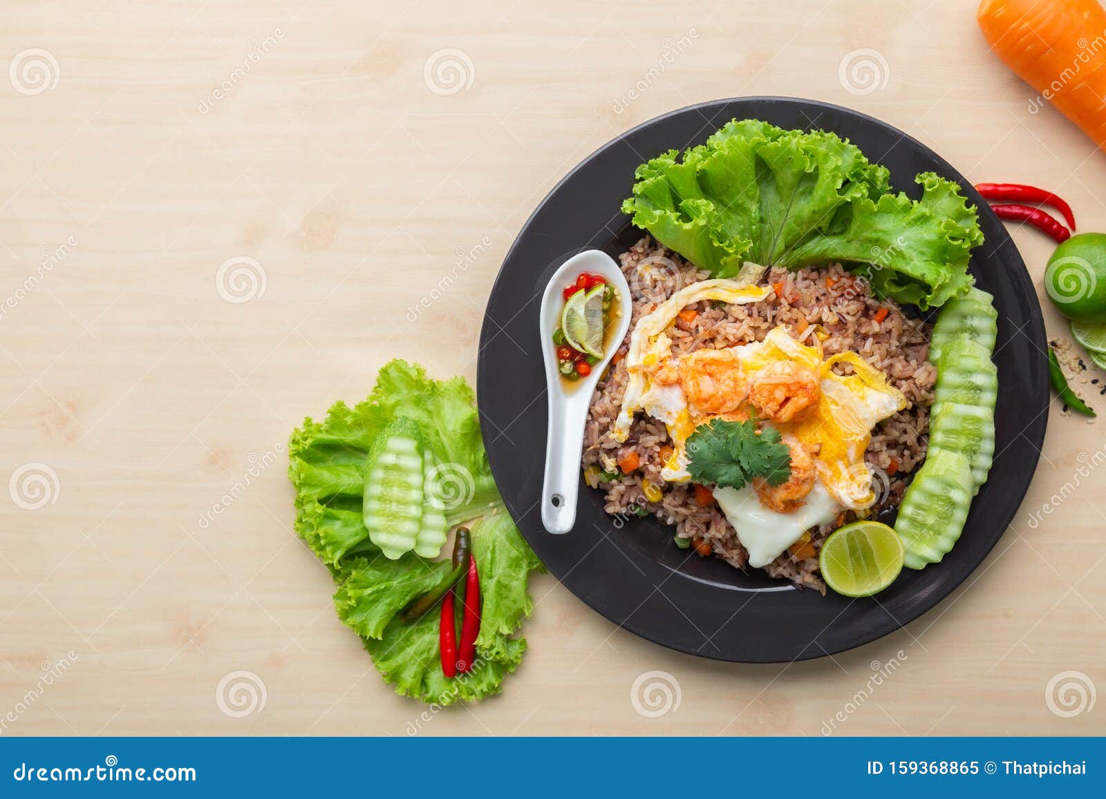 Fried Brown Rice with Shrimp and Fried Egg in Thai. Prepared and Served