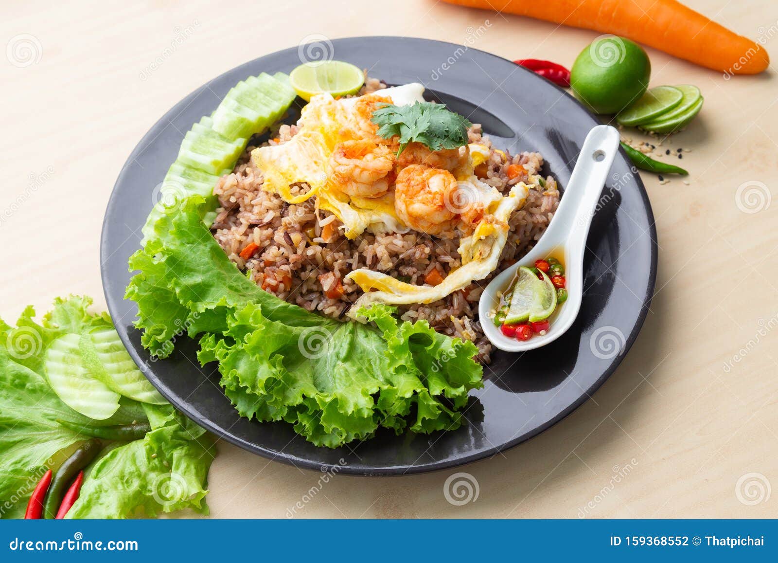 Fried Brown Rice with Shrimp and Fried Egg in Thai. Prepared and Served