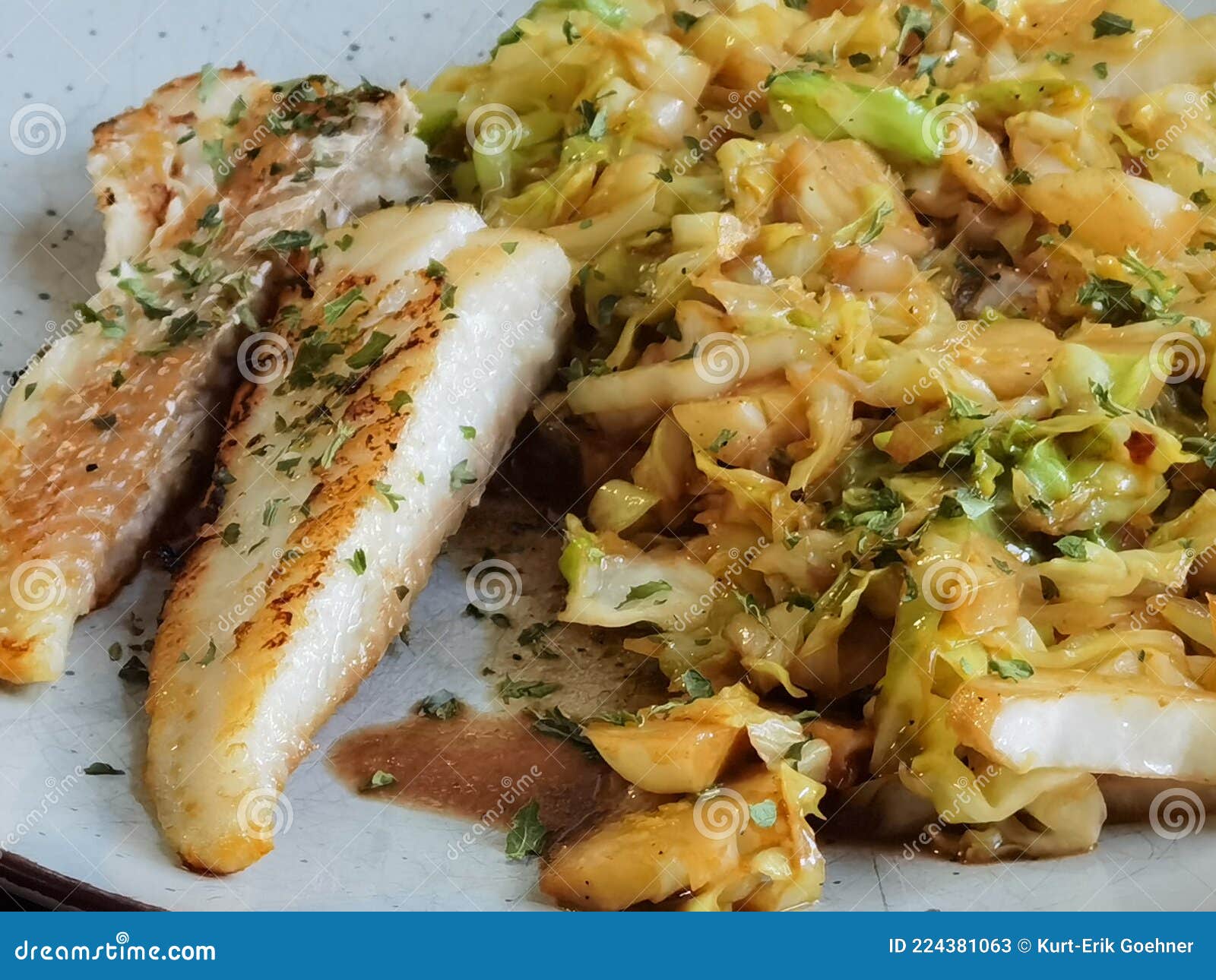 Fried cabbage with fish stock image. Image of produce 224381063