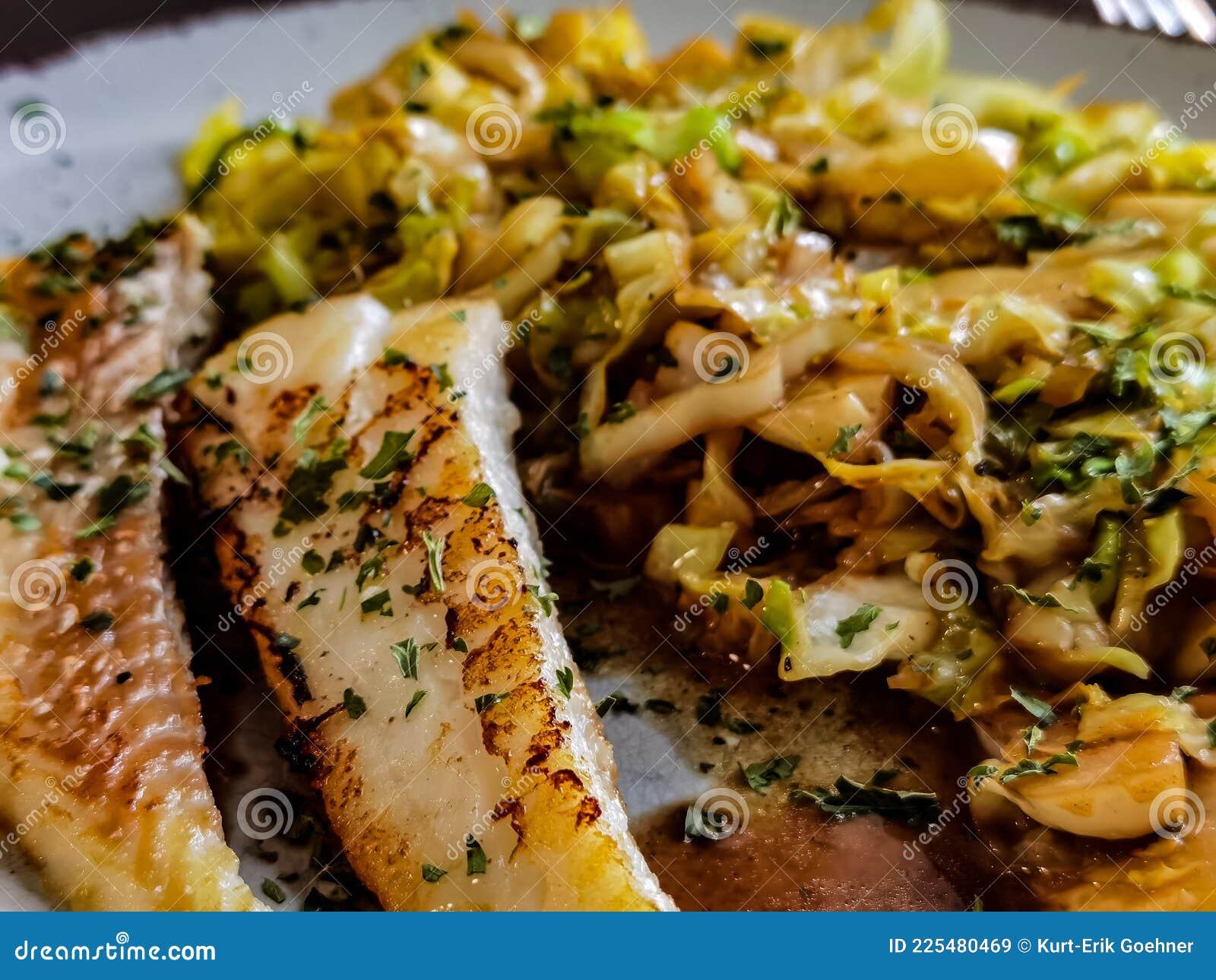 Fried cabbage with fish stock image. Image of curry 225480469