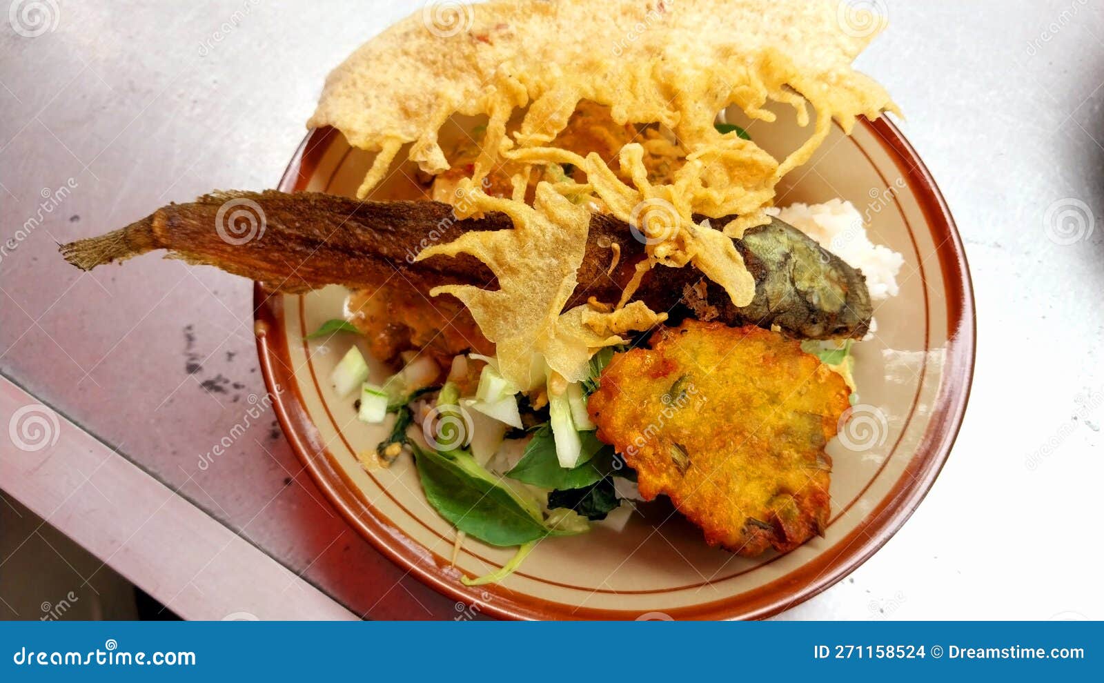 Fried Catfish with Mixed Vegetables in Peanut Sauce and Peanut Crackers