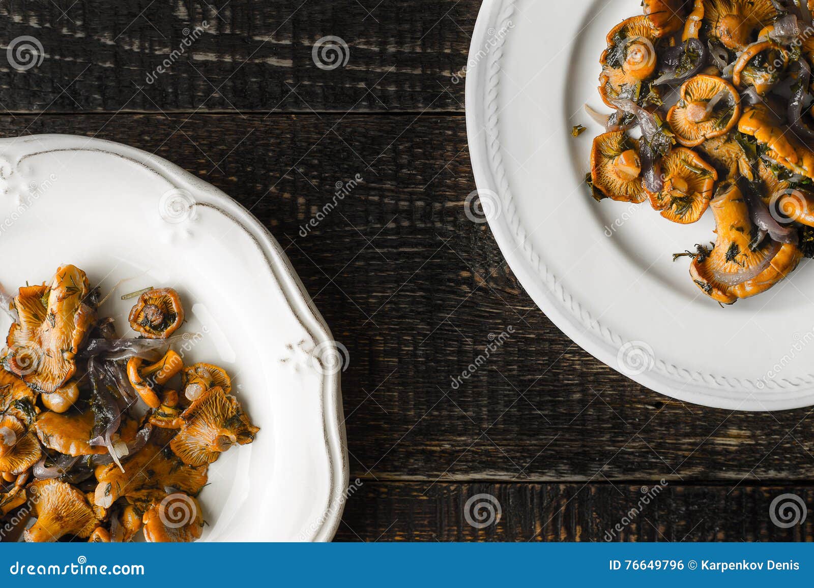 Fried Chanterelles in the Ceramic Plates on the Old Wooden Table Top