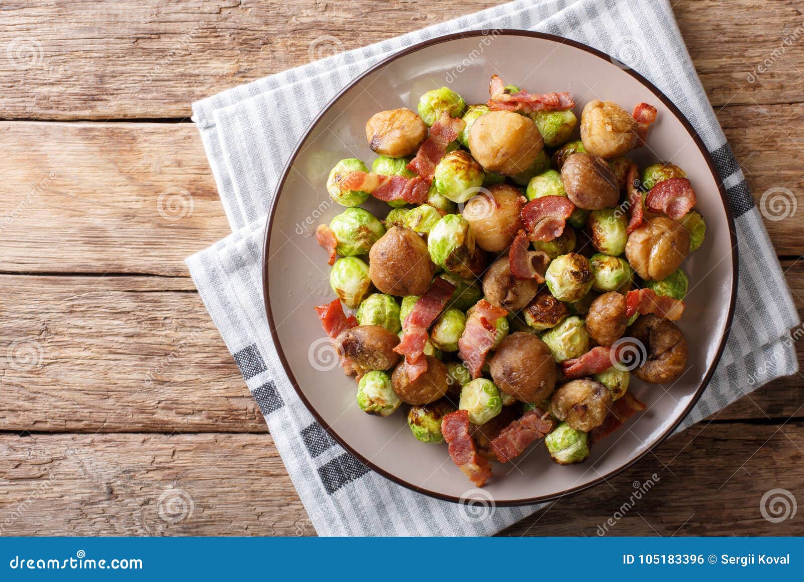 Fried Chestnuts, Brussels Sprouts and Bacon Closeup. Horizontal Stock