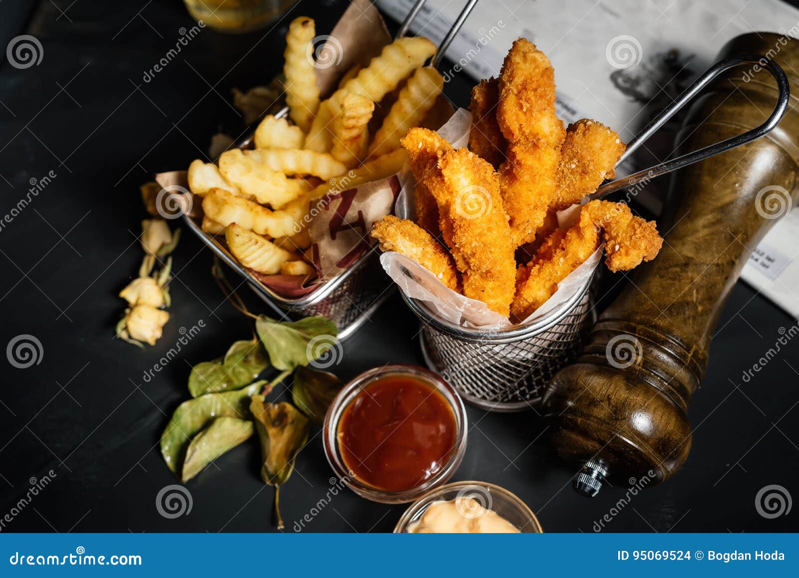 fried chicken, chicken tenders or fingers served at restaurant with fries and mayo