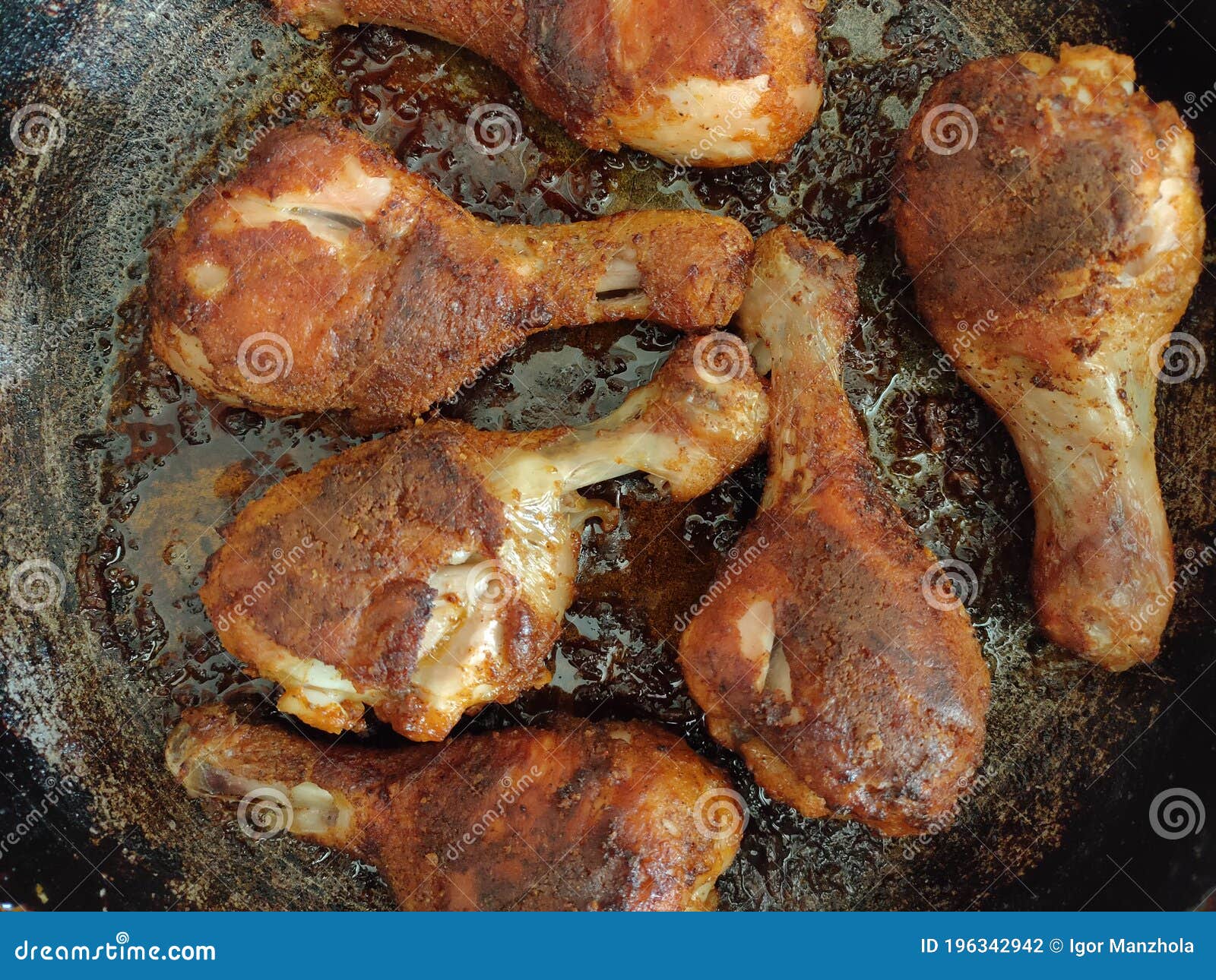 Fried Chicken Drumsticks on the Frying Pan, Top View. Fried Chicken