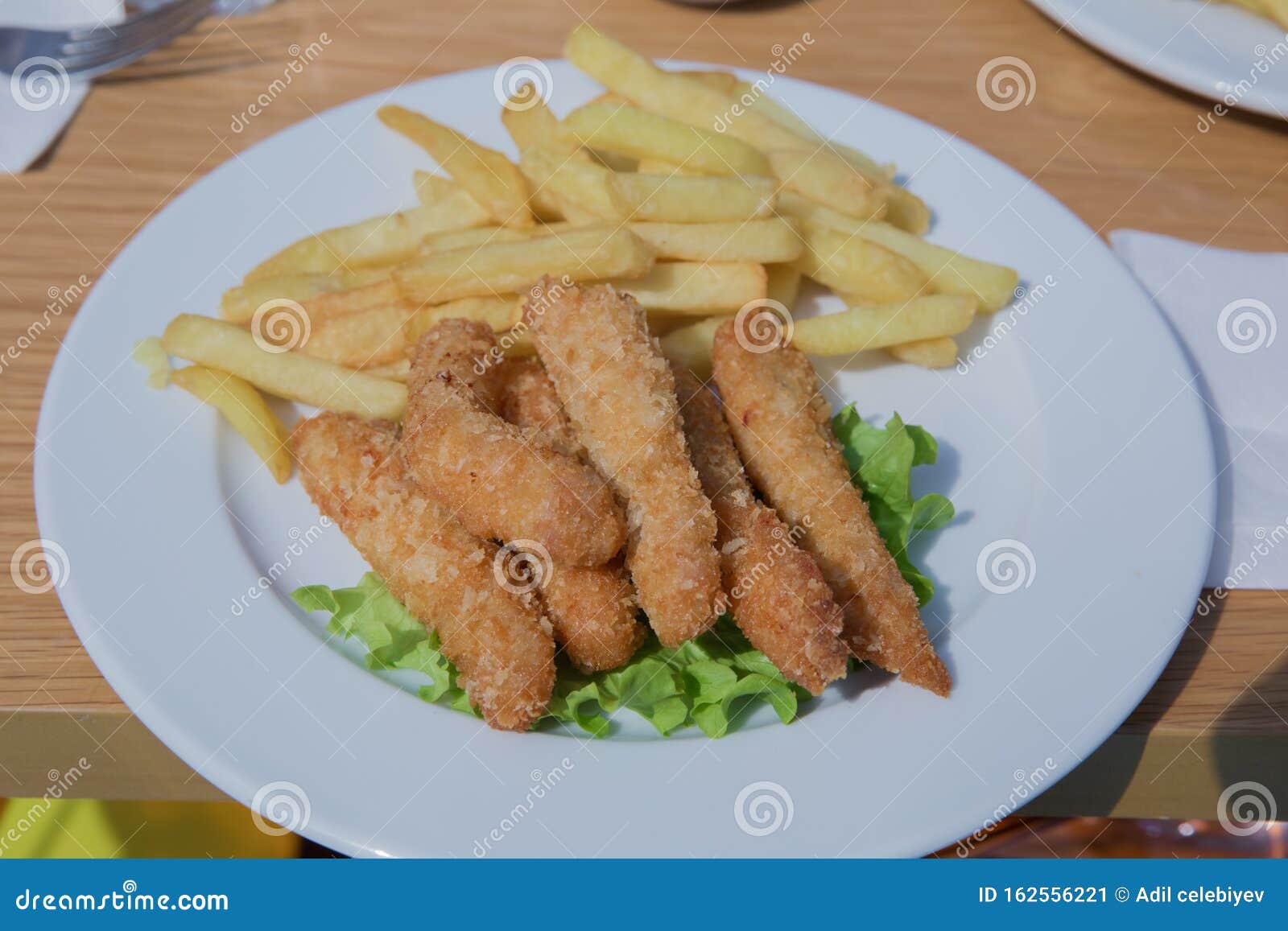 Fried Chicken and French Fries . Chicken Tenders with French Fries and ...
