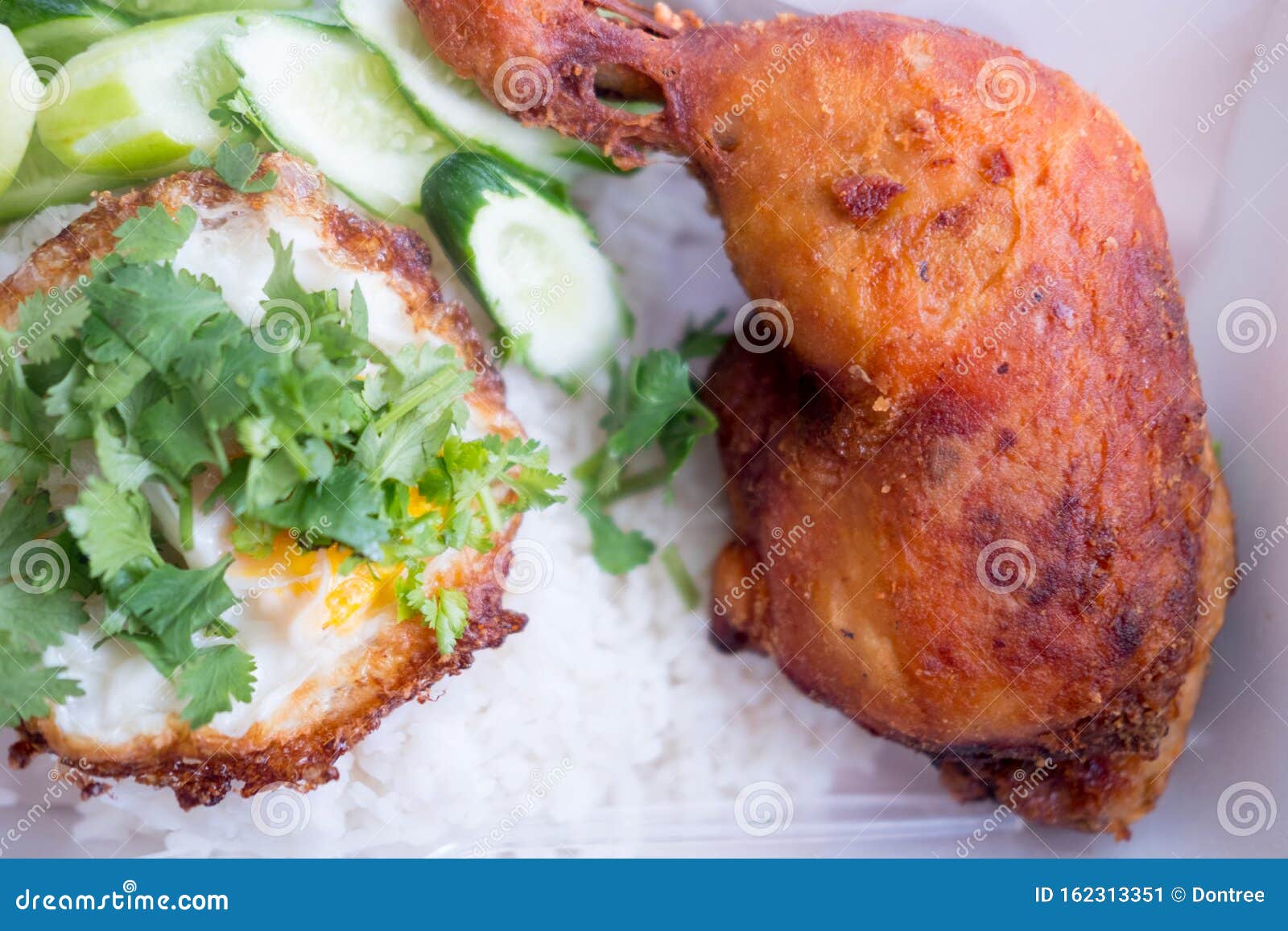 Fried Chicken Thigh with Fried Egg on Rice in from Box Stock Image Image of meat, rice 162313351