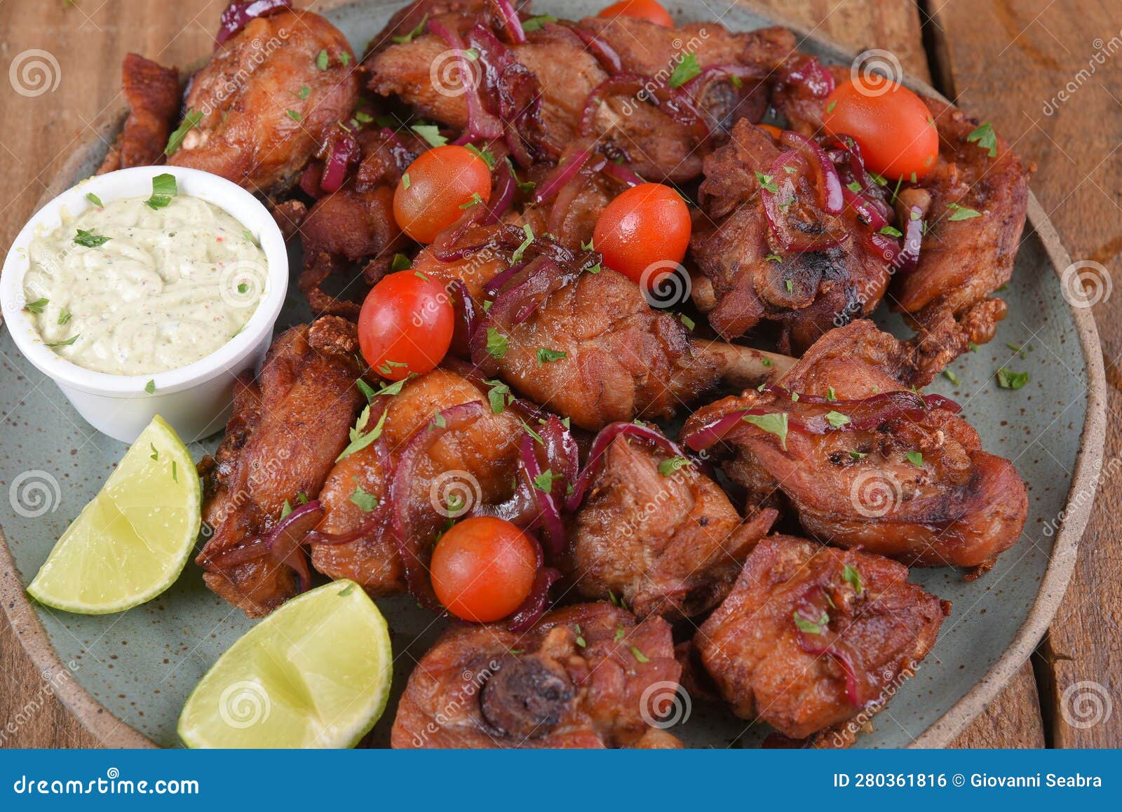 Fried Chicken with Tomatoes and Caramelized Onions Wings with Herb Sauce Stock Photo Image of