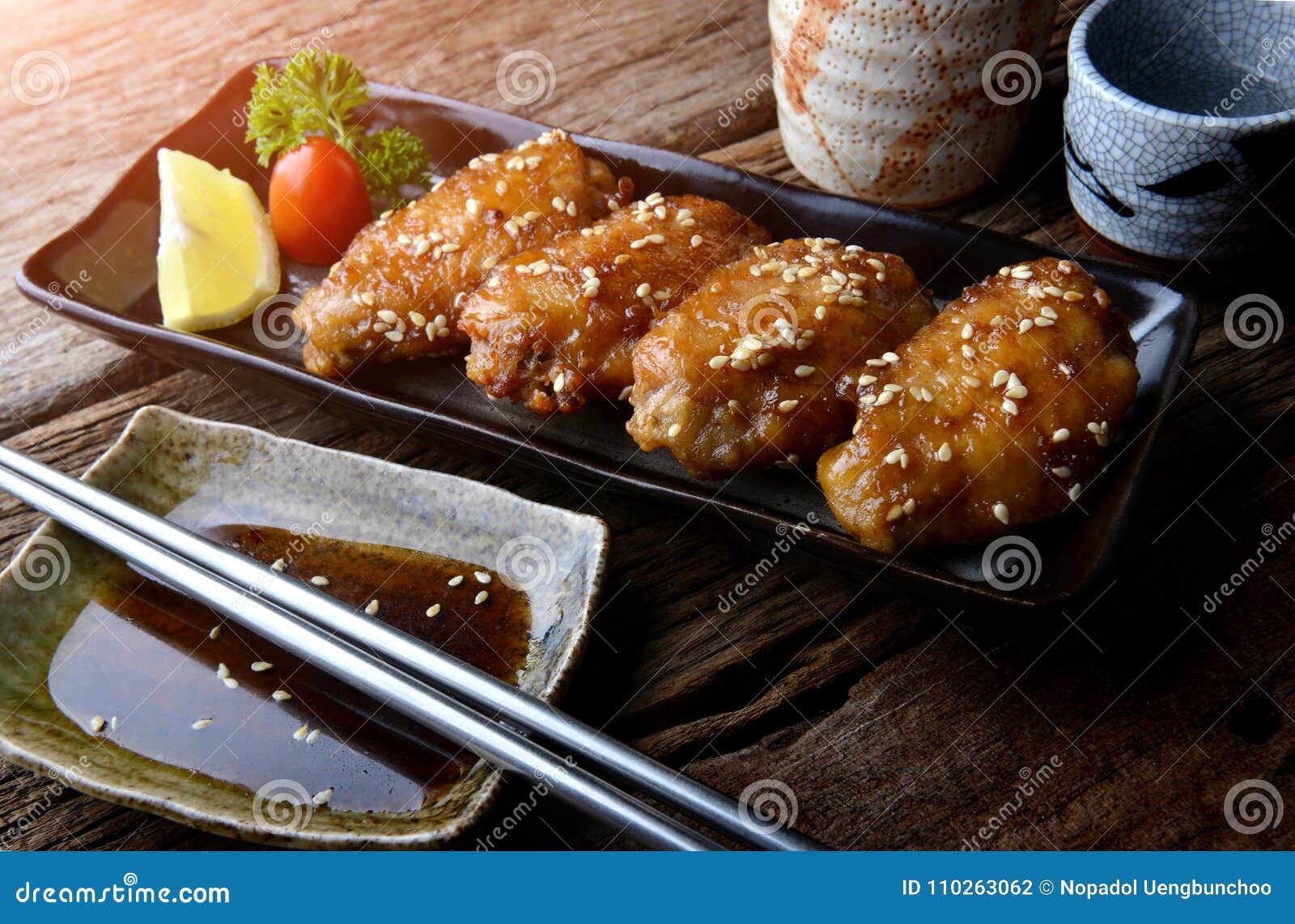 fried chicken wing with spicy sauce in japanese style.