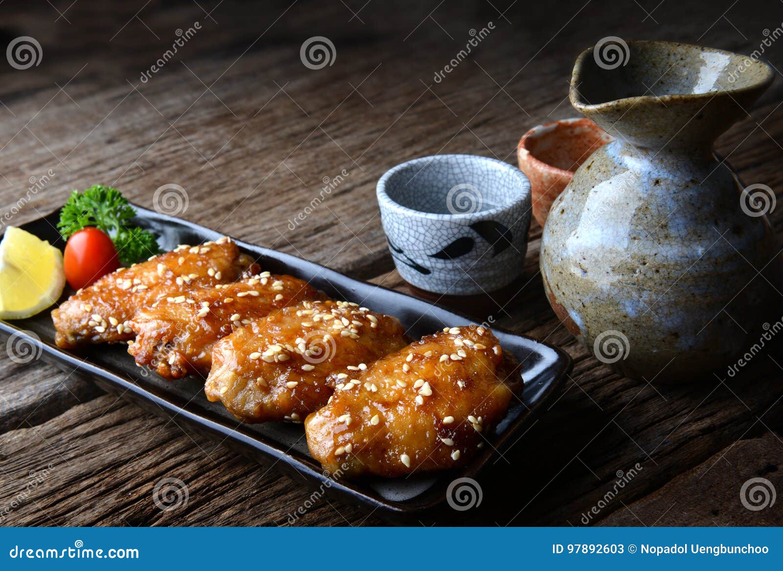 fried chicken wing with spicy sauce in japanese tebasaki style.
