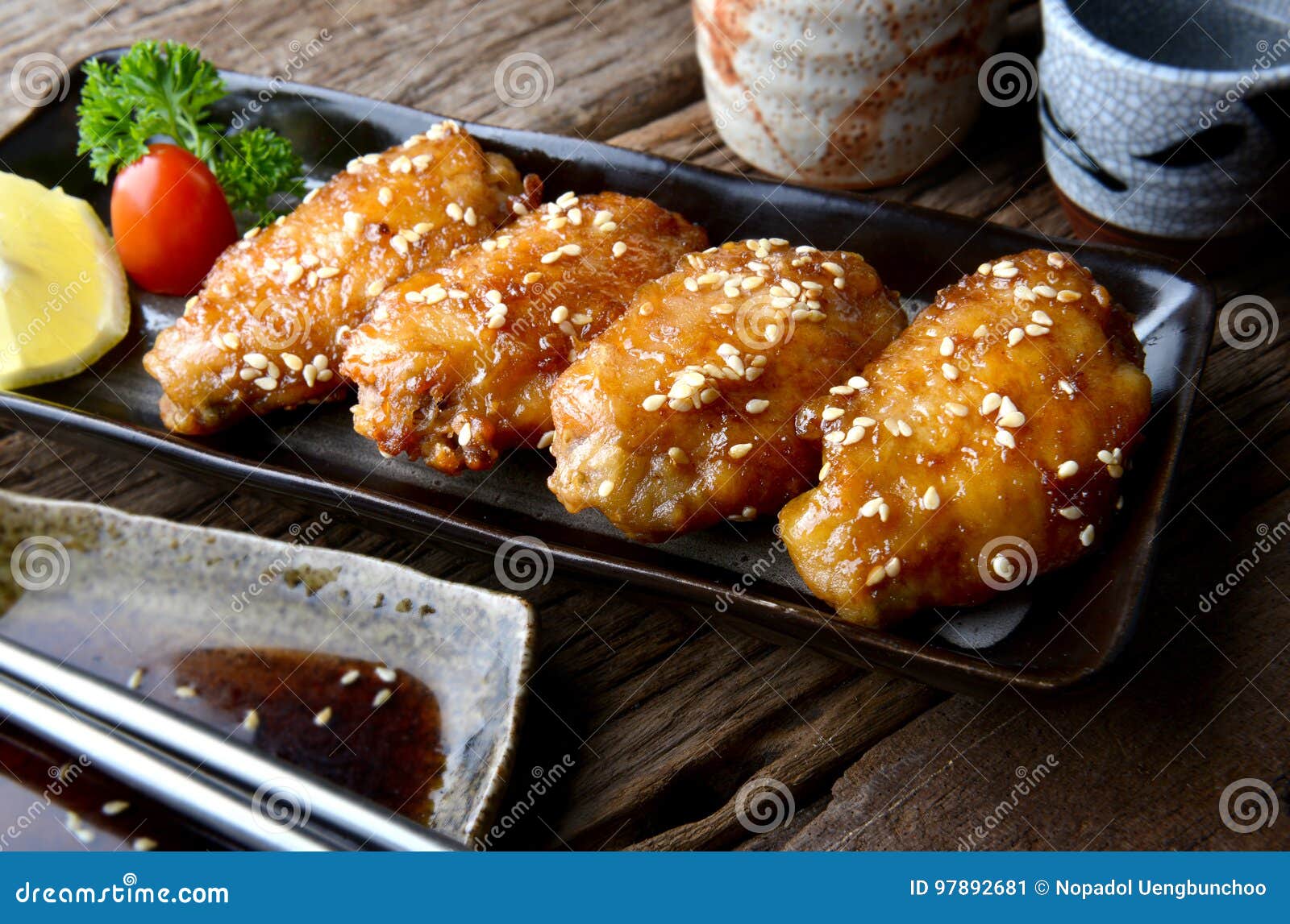 fried chicken wing with spicy sauce in japanese tebasaki style.