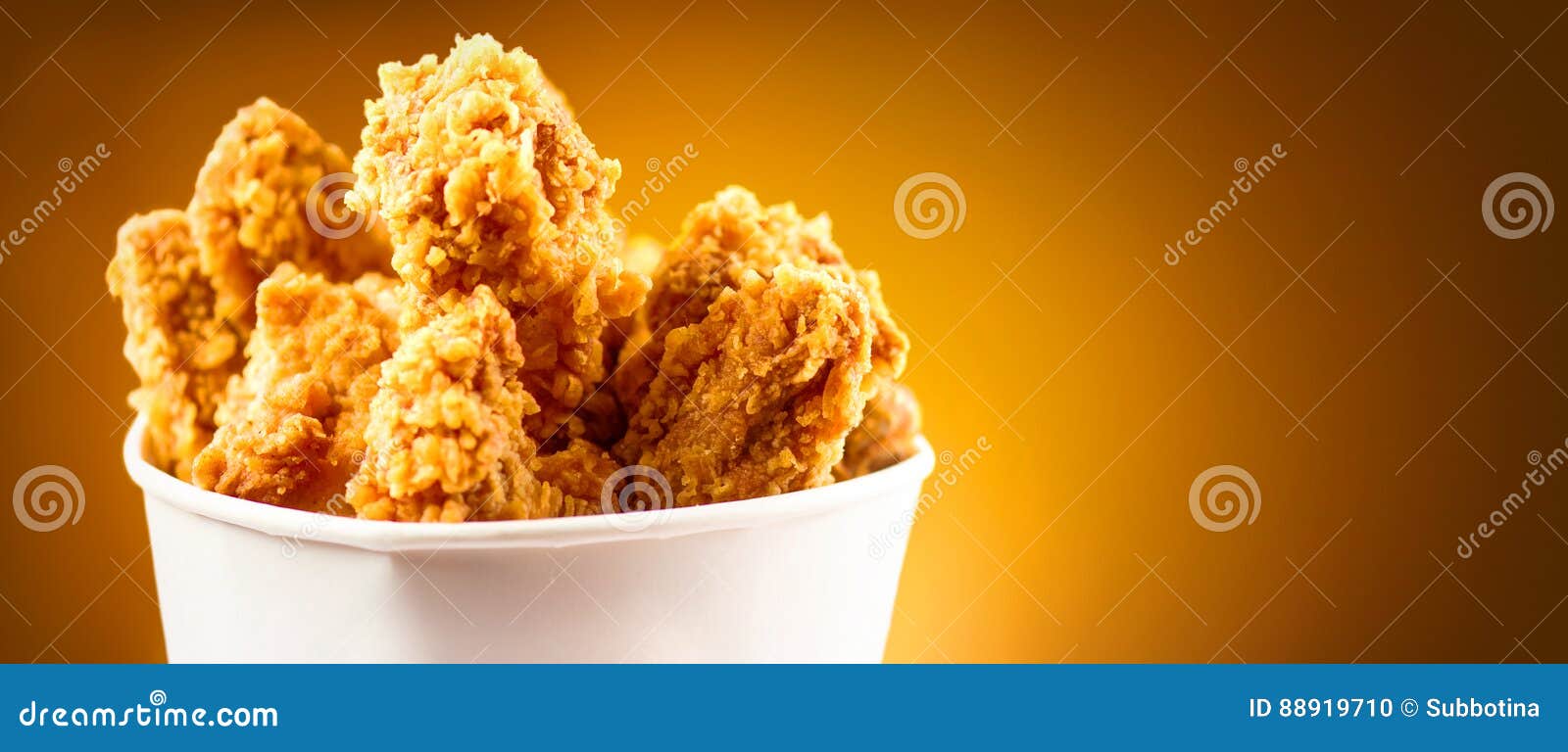 fried chicken wings. bucket full of crispy kentucky fried chicken
