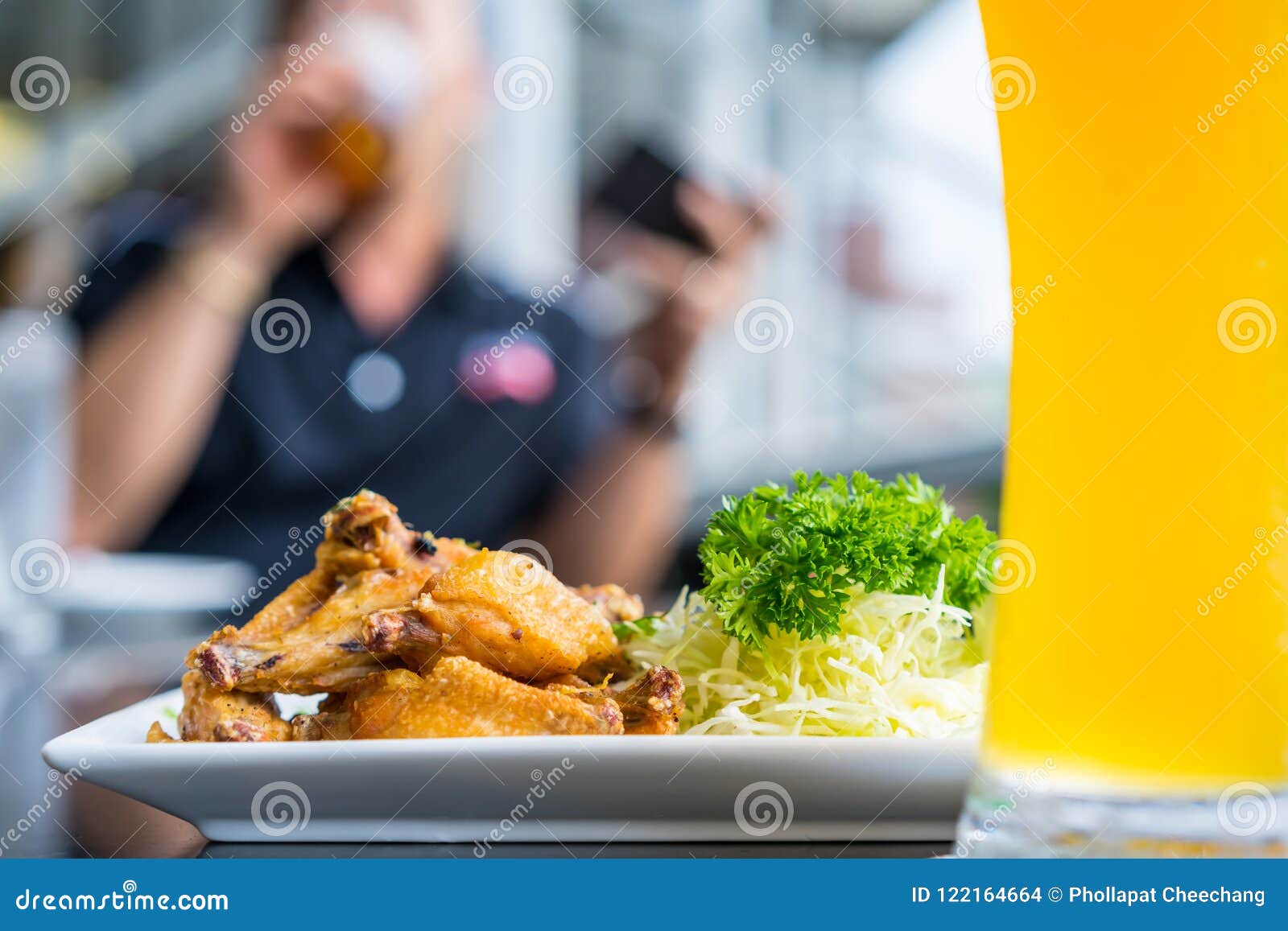 Fried Chicken Wings with Dipping Sauces and Vegetables Stock Photo