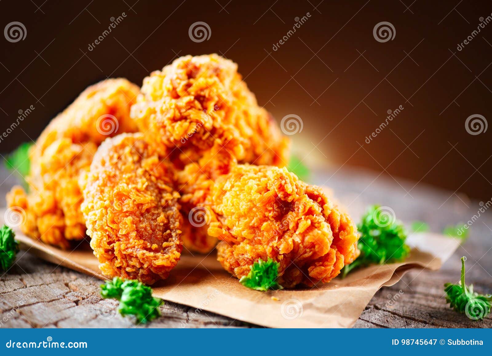 fried chicken wings and legs on wooden table