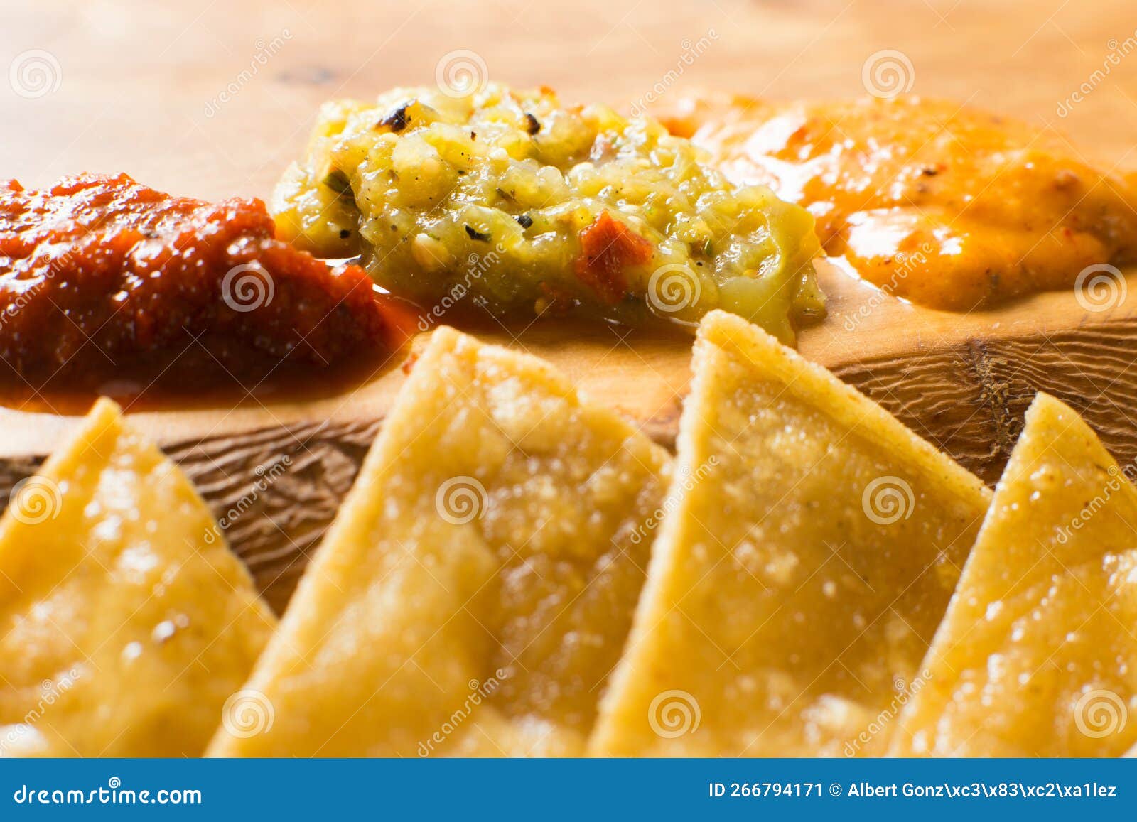 Fried Corn Tortillas with Different Hot Pepper Sauces. Stock Image