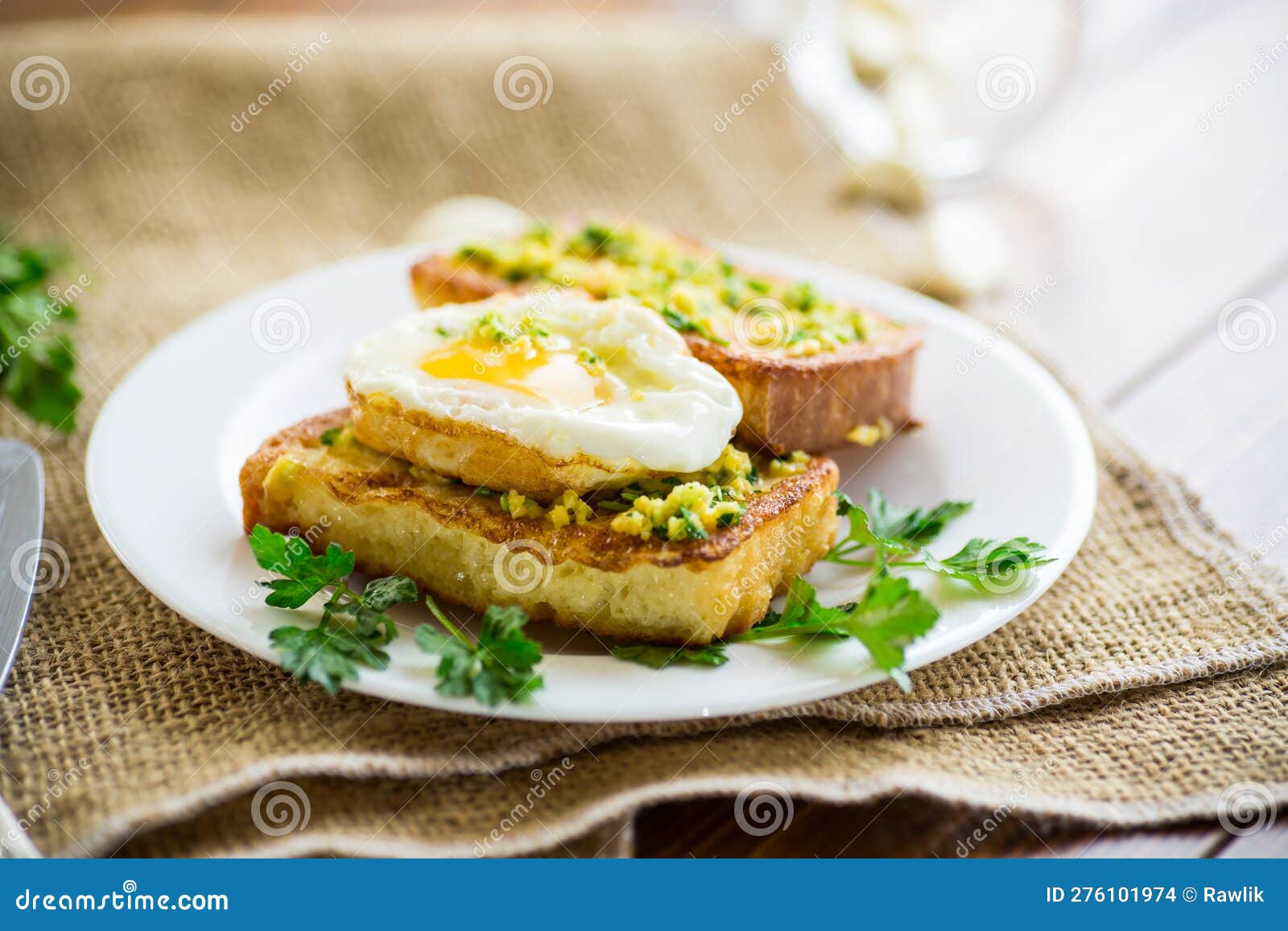 Fried Croutons in Batter with Garlic and Herbs and a Fried Egg in a
