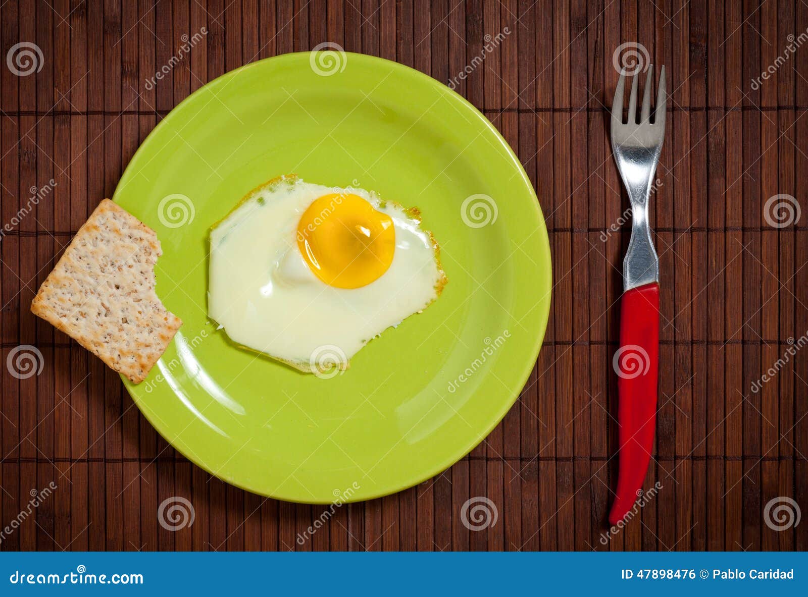 Fried egg in green plate stock photo. Image of dinner 47898476
