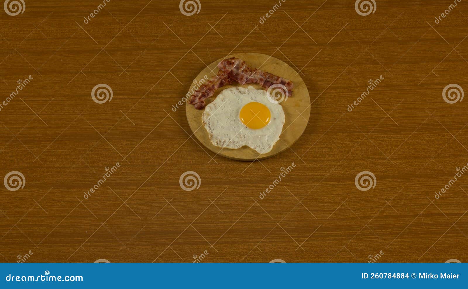 fried egg, with hen drawn, hard-boiled egg with yellow yolk coming out on the cutting board