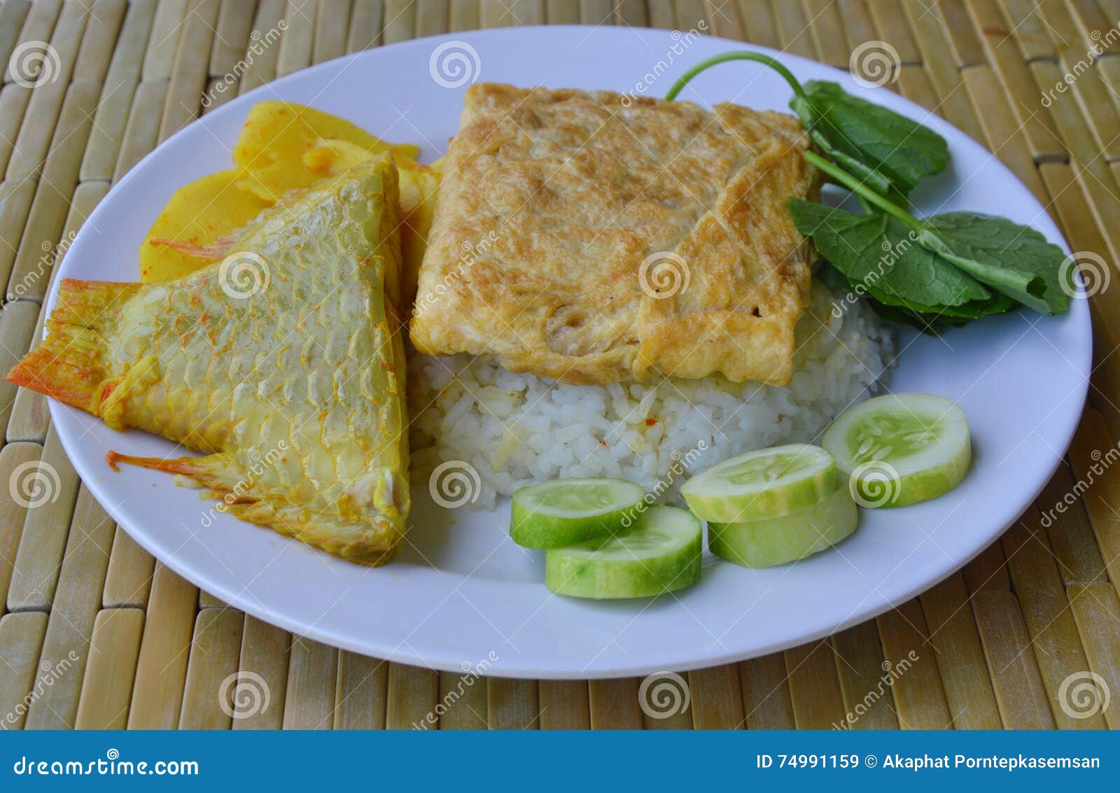 Fried Egg and Pickled Bamboo Shoot Mango Fish Curry on Rice Stock Image