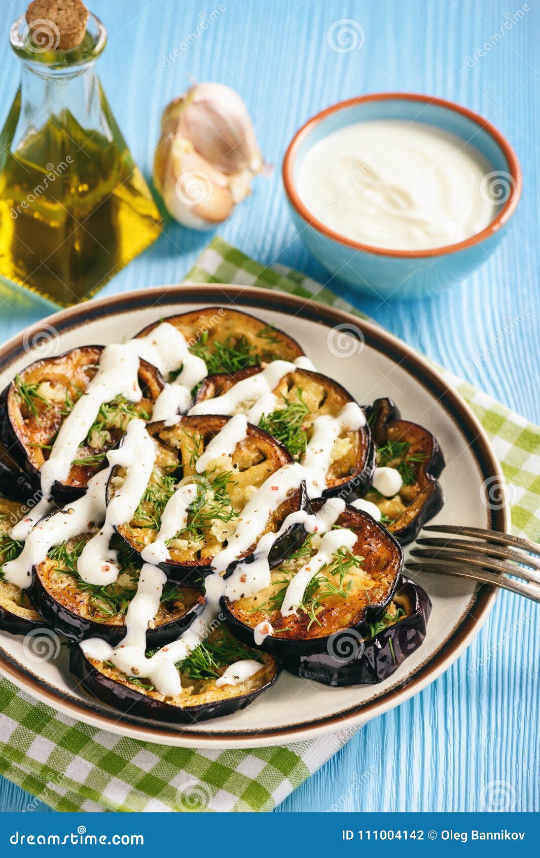 Fried Eggplants with Garlic and Yogurt Sauce. Stock Photo Image of