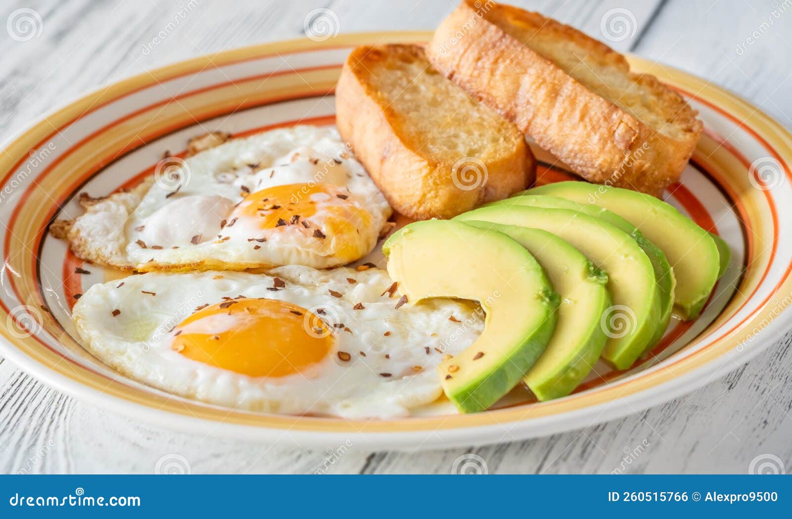 Fried eggs with avocado stock photo. Image of cuisine 260515766