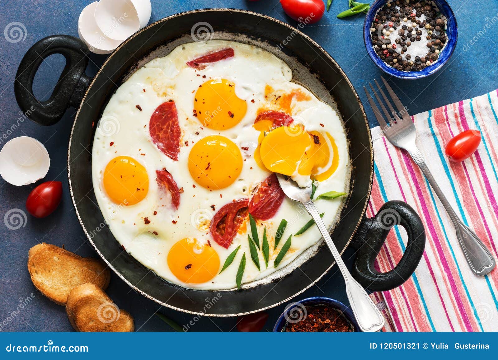 Fried Eggs with Cherry Tomatoes in a Pan. Fresh and Hearty Breakfast