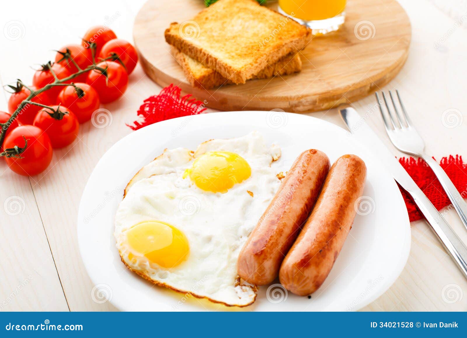 Fried eggs with sausages. stock photo. Image of sausage 34021528
