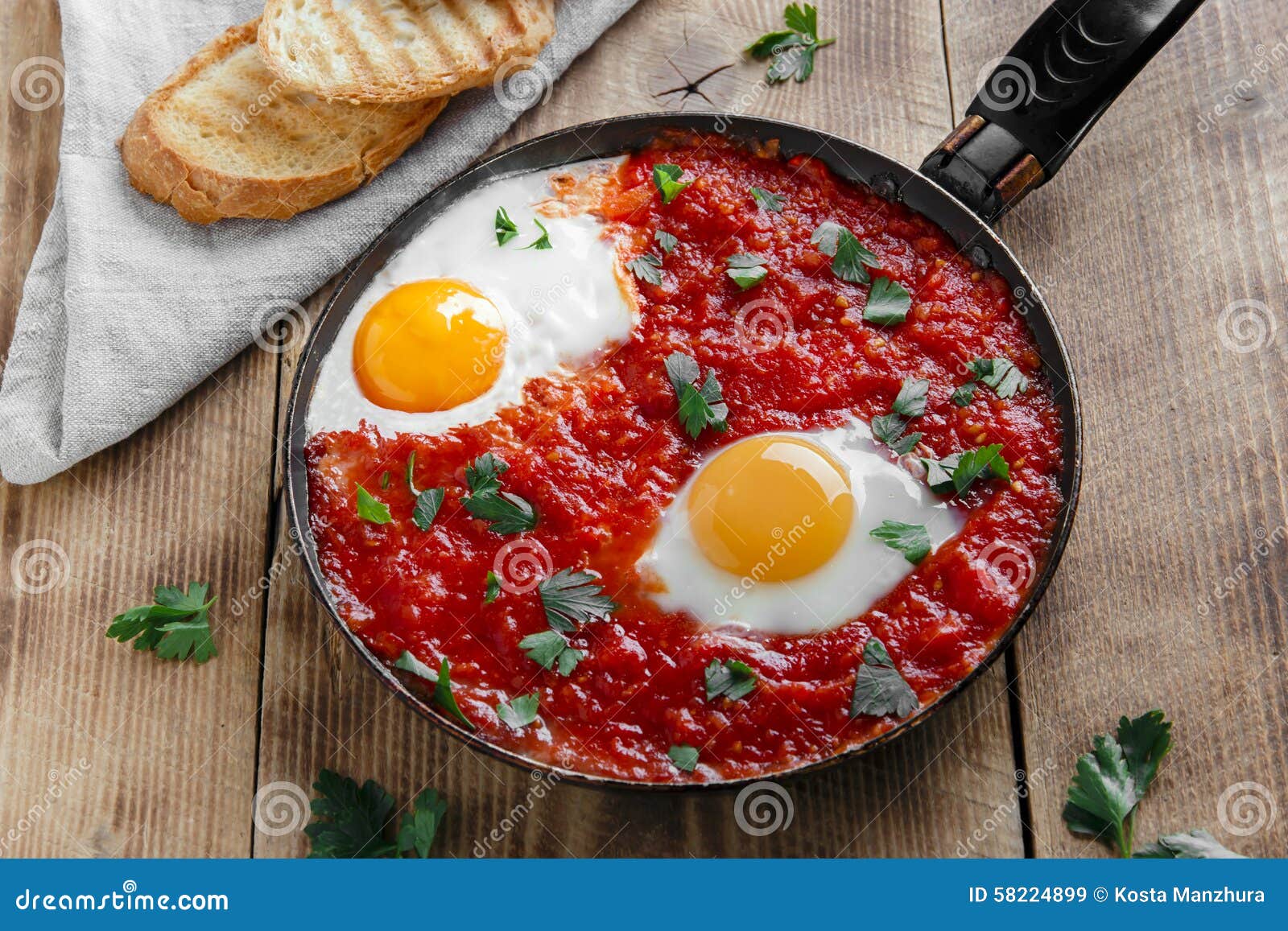 Fried eggs in tomato sauce stock image. Image of white 58224899