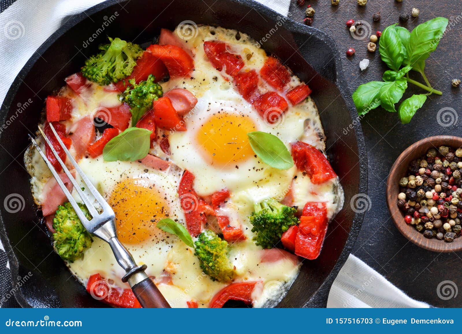 Fried Eggs with Tomatoes, Peppers and Broccoli for Breakfast on the