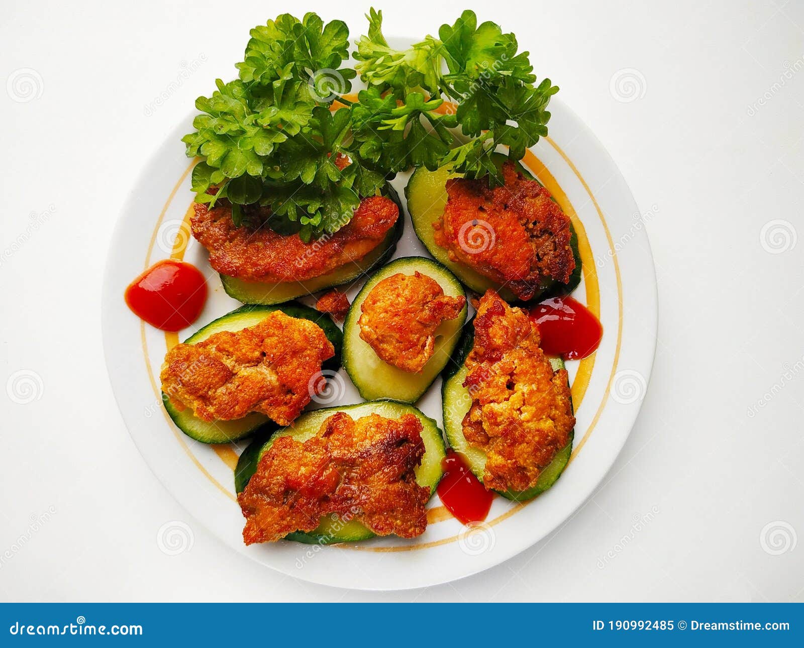 fried fish roe on a cucumber slice decorated with dill