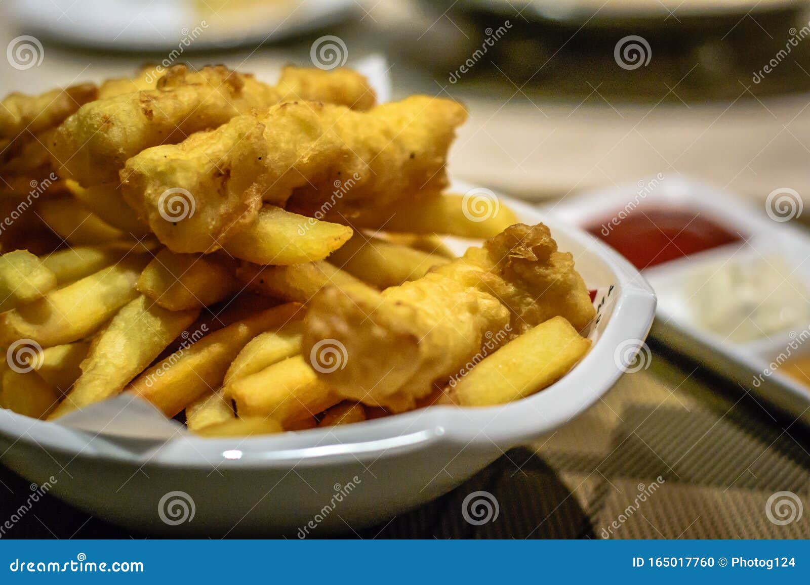 Fried Fish and Chips with Tomato Ketchup, Tartar Sauce and Mustard