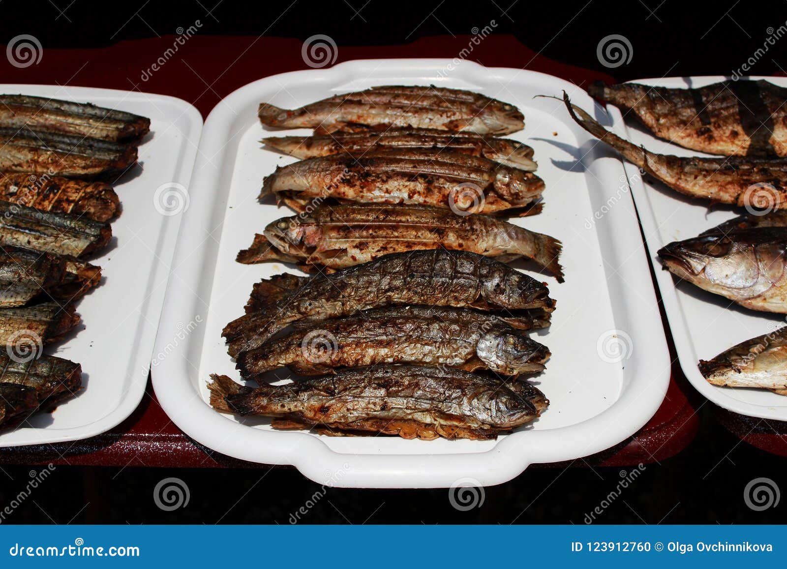 Fried Fish Cooked Entirely On An Open Fire On The Embankment Near The Black Sea On The Grill ...