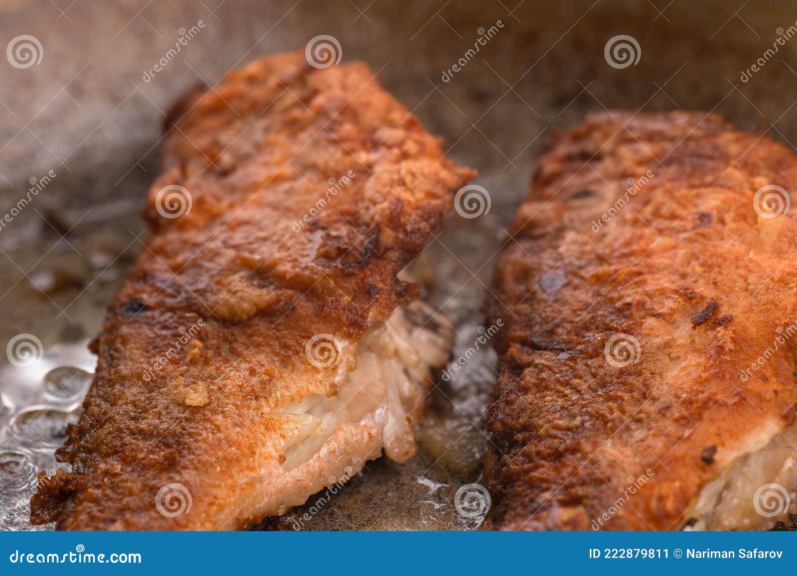 Fried fish in oil in a pan stock image. Image of cooked 222879811
