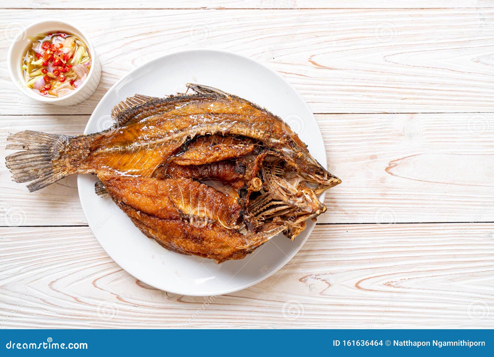 Fried Fish with Fish Sauce stock photo. Image of fried 161636464