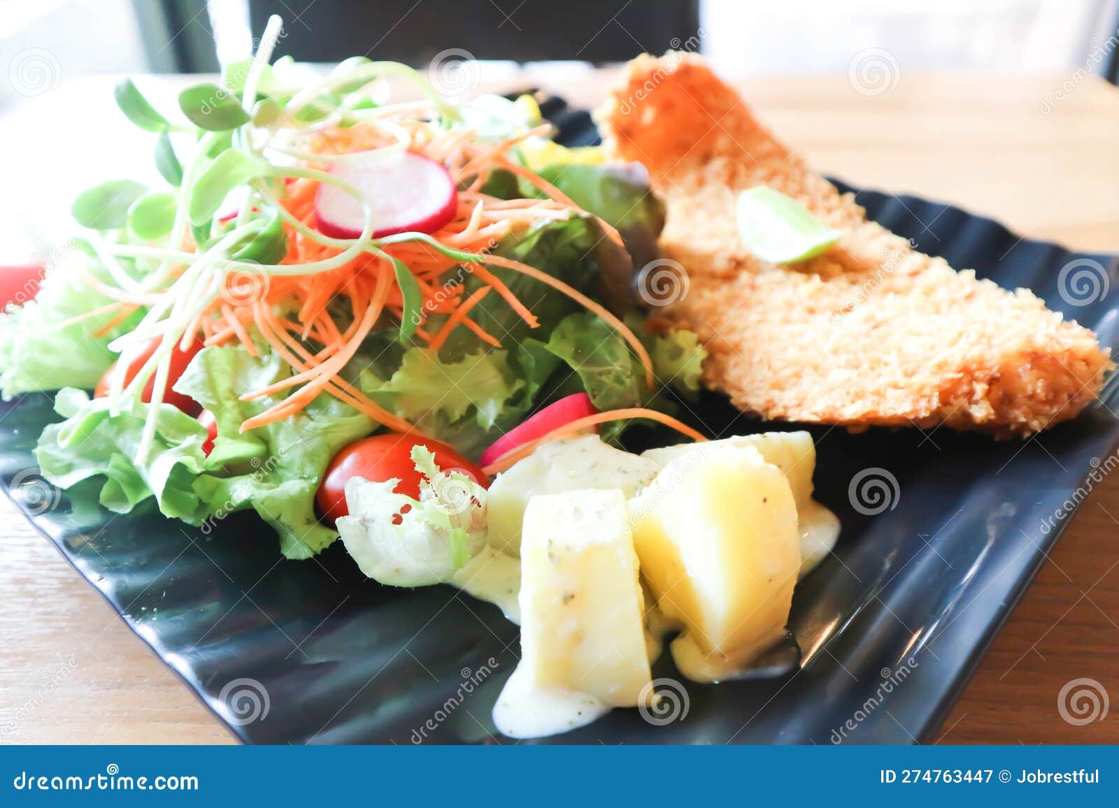 Fried Fish with Tomato Gravy and Salad or Fish and Chips Stock Image