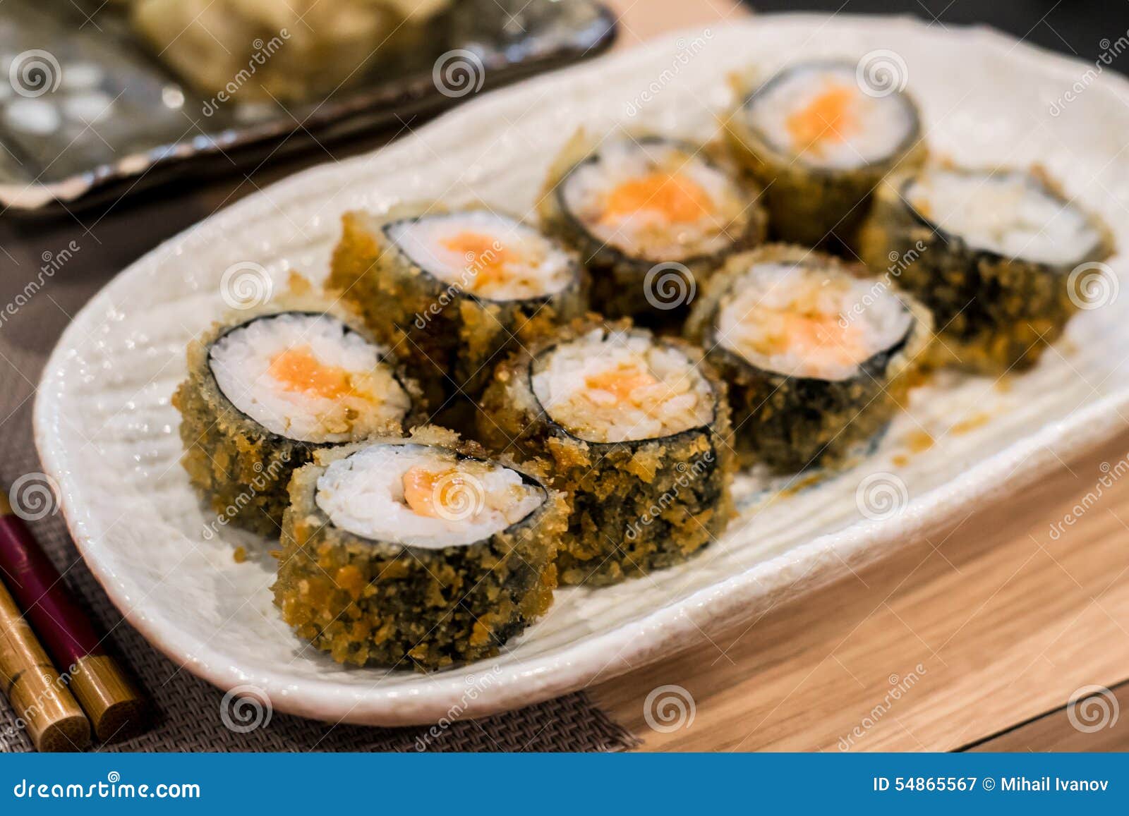 fried hossomaki sushi rolls with fresh raw salmon and white rice