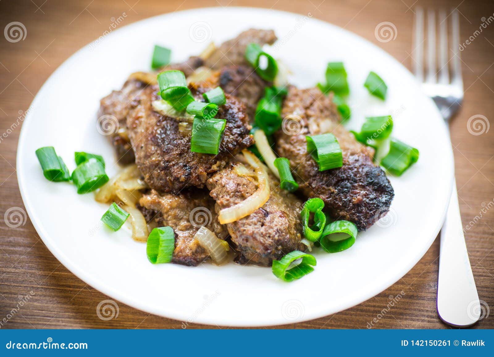 Fried Liver with Onions in a Plate on a Wooden Stock Image - Image of ...